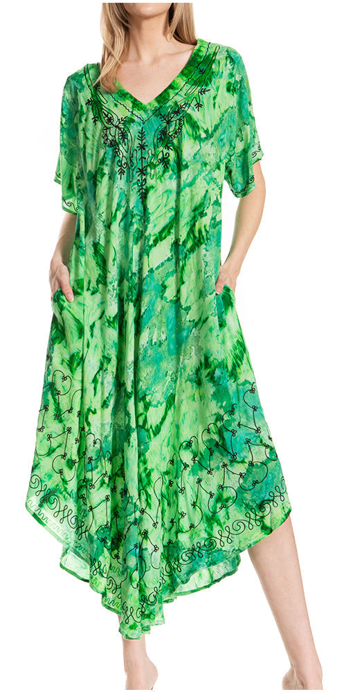 Green patterned dress worn by a model on a white background