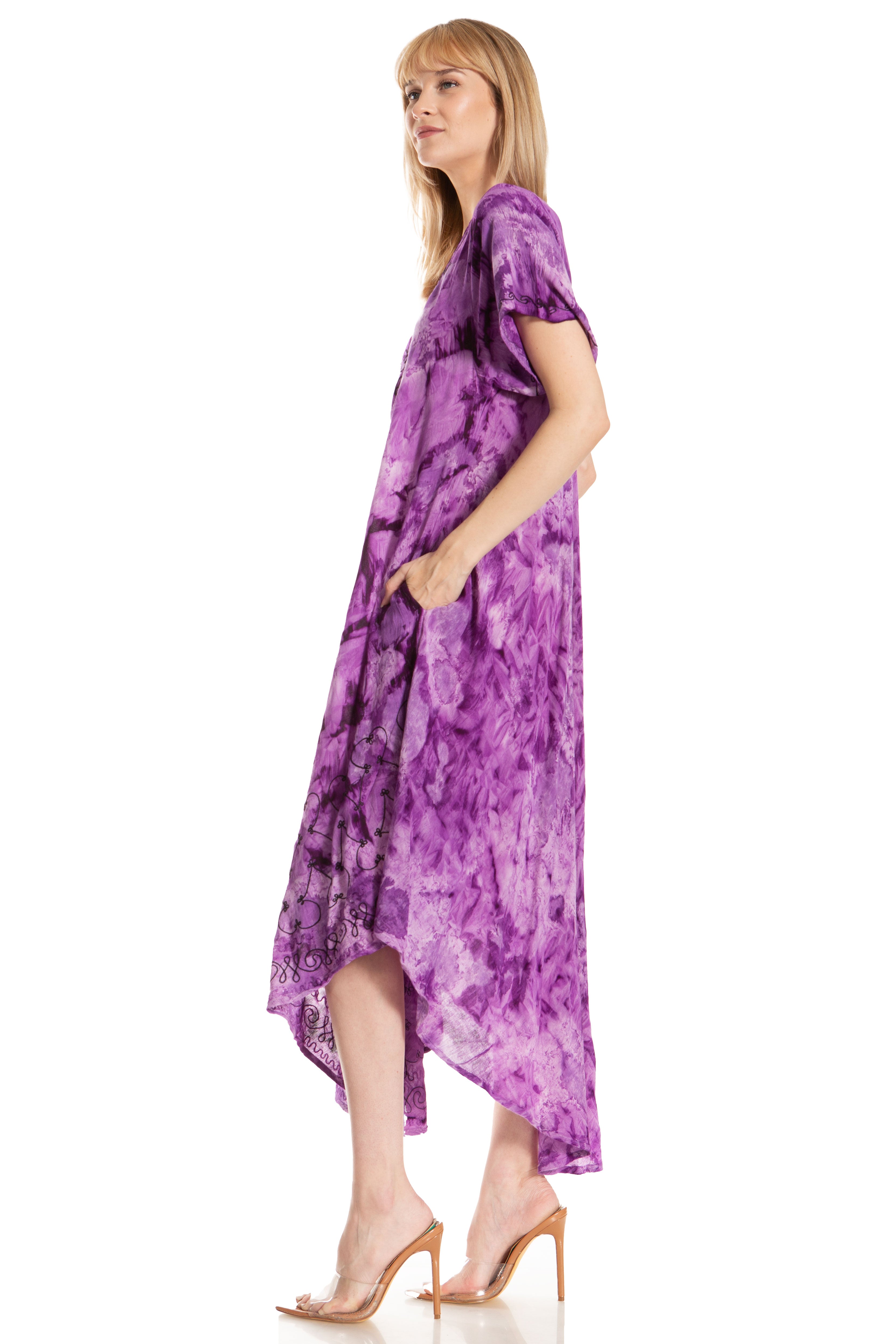 Woman wearing a purple tie-dye dress on a white background