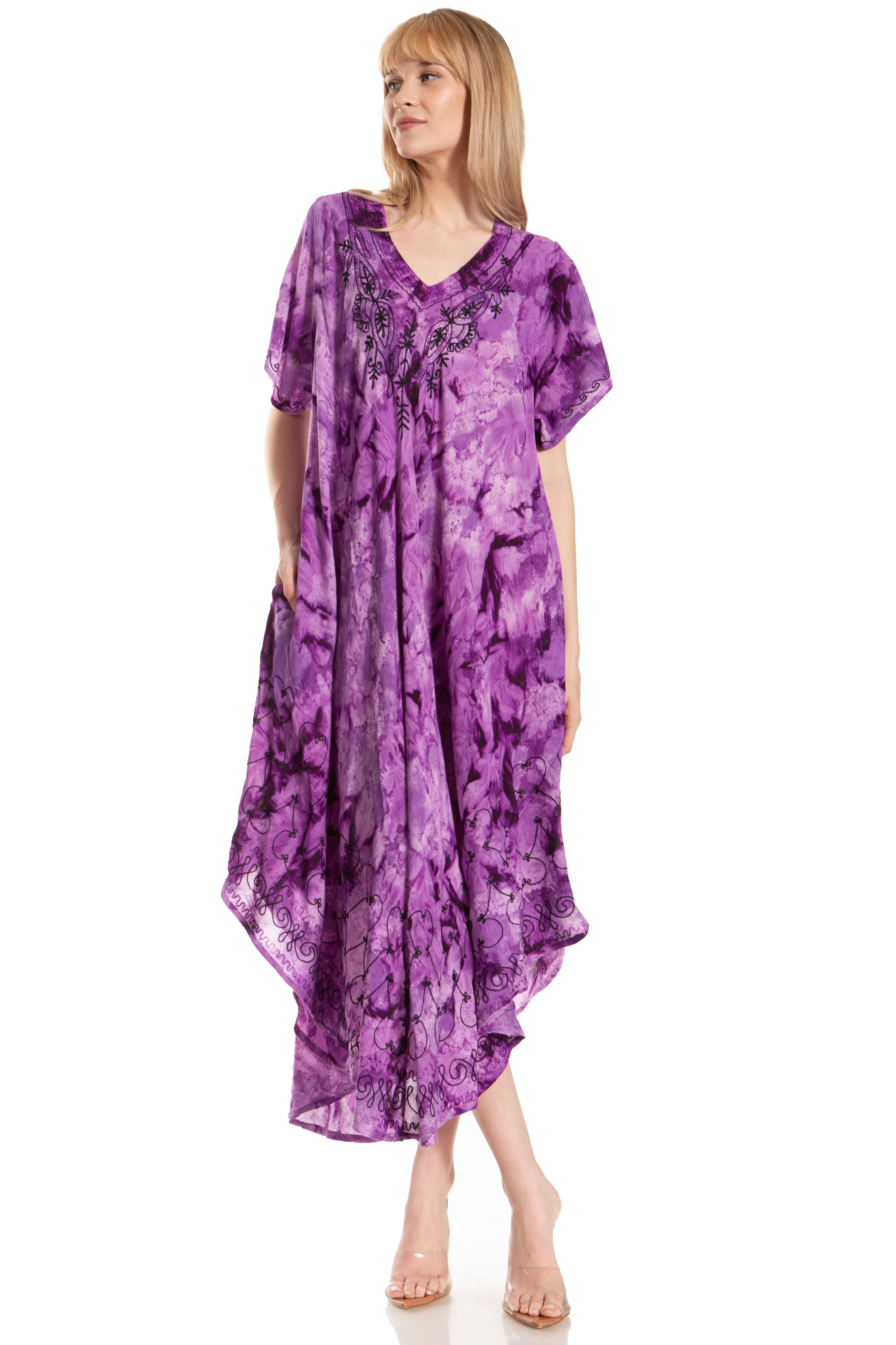 Woman wearing a purple tie-dye dress on a white background
