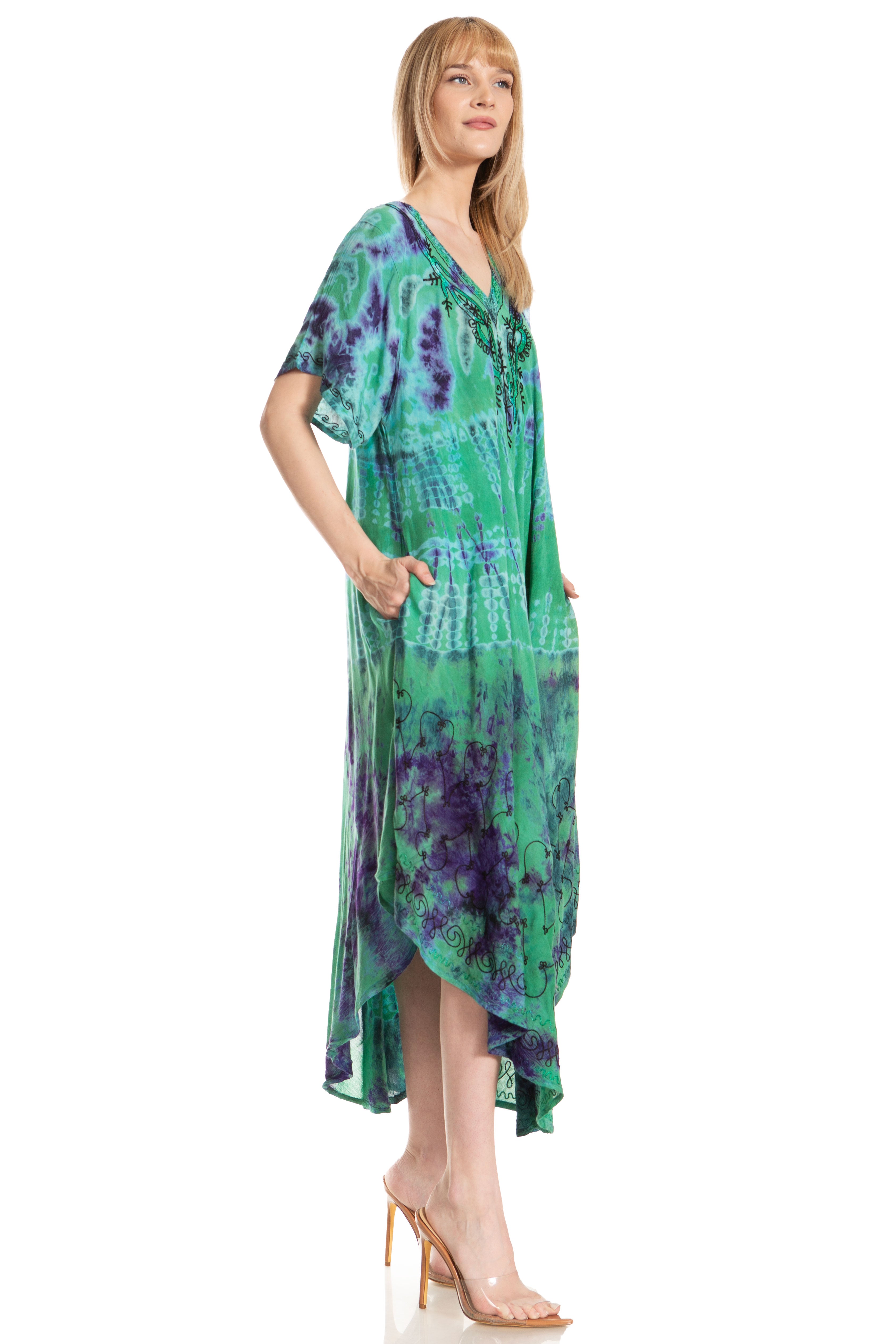 Woman wearing a green and purple tie-dye dress on a white background