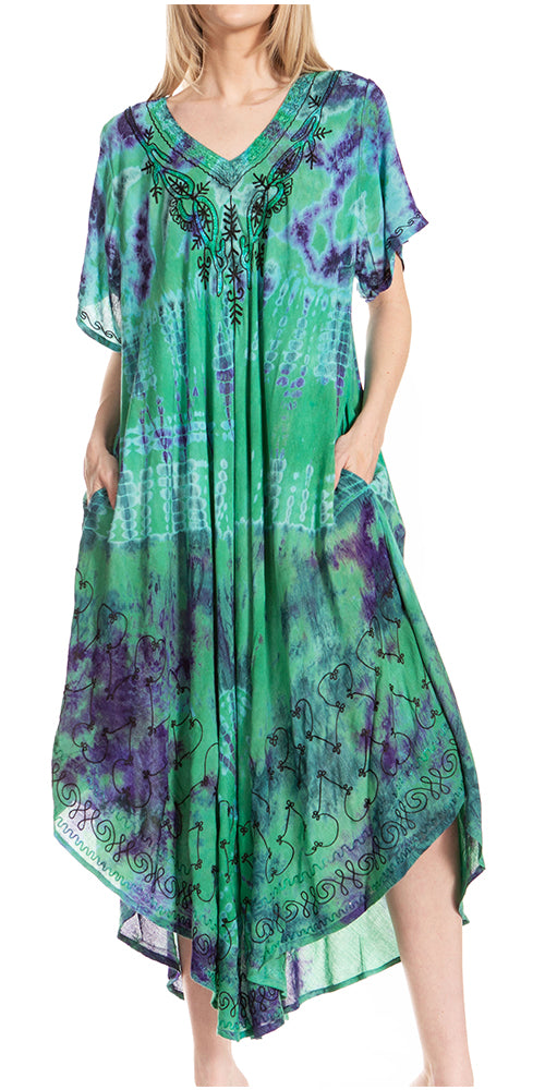 Green and purple patterned dress on a white background