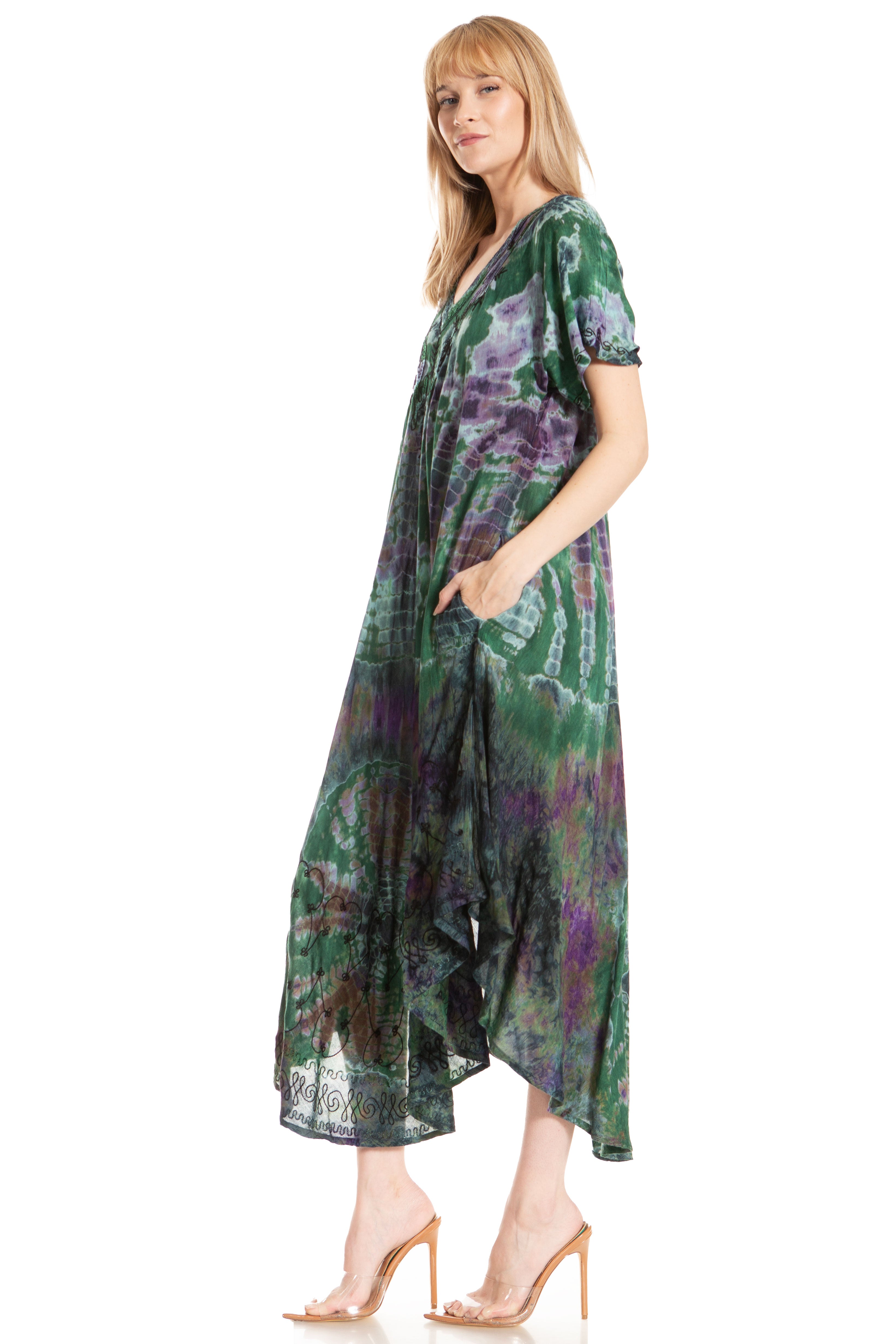 Woman wearing a green and purple floral dress on a white background