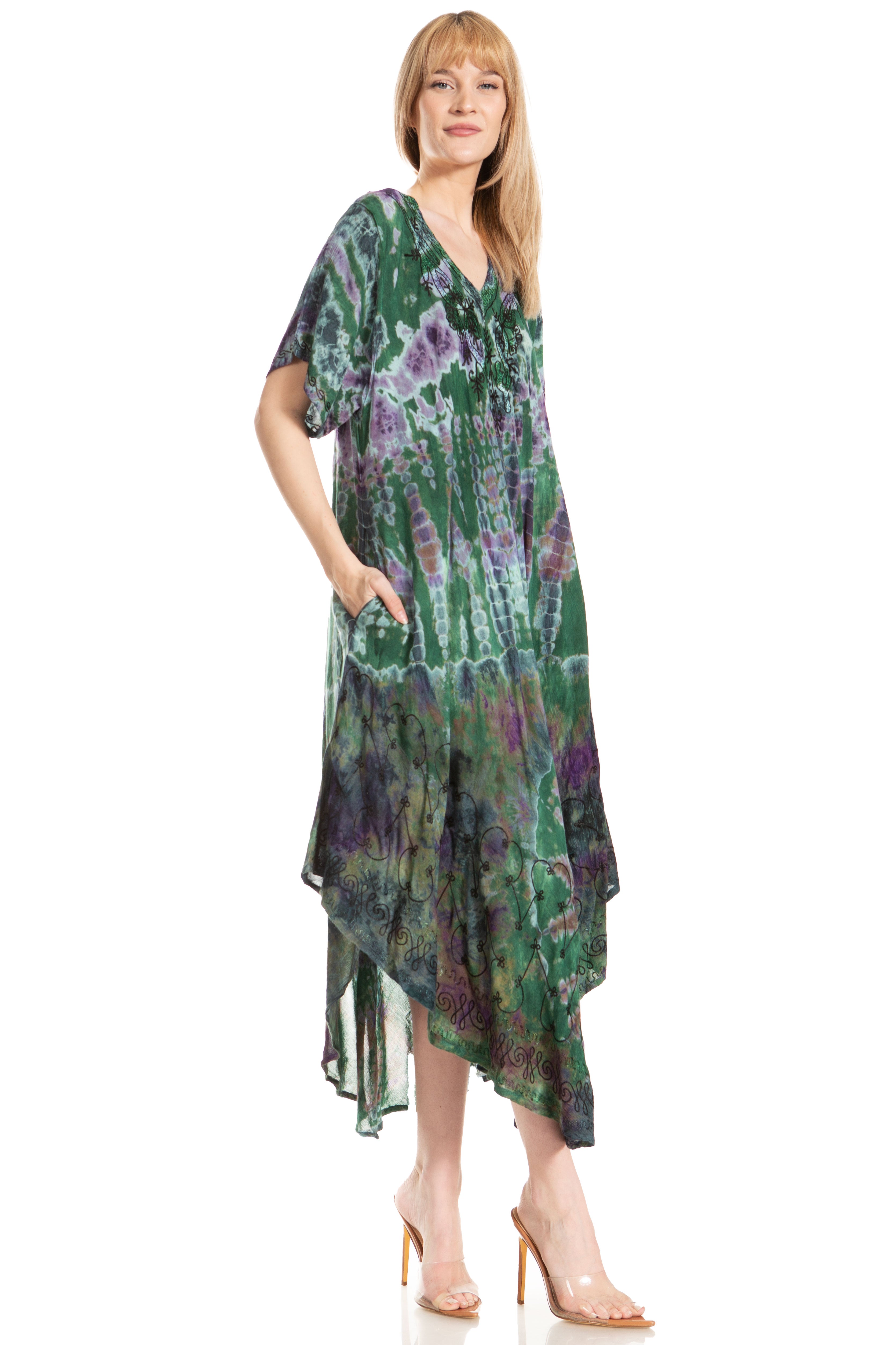 Woman wearing a green and purple patterned dress on a white background