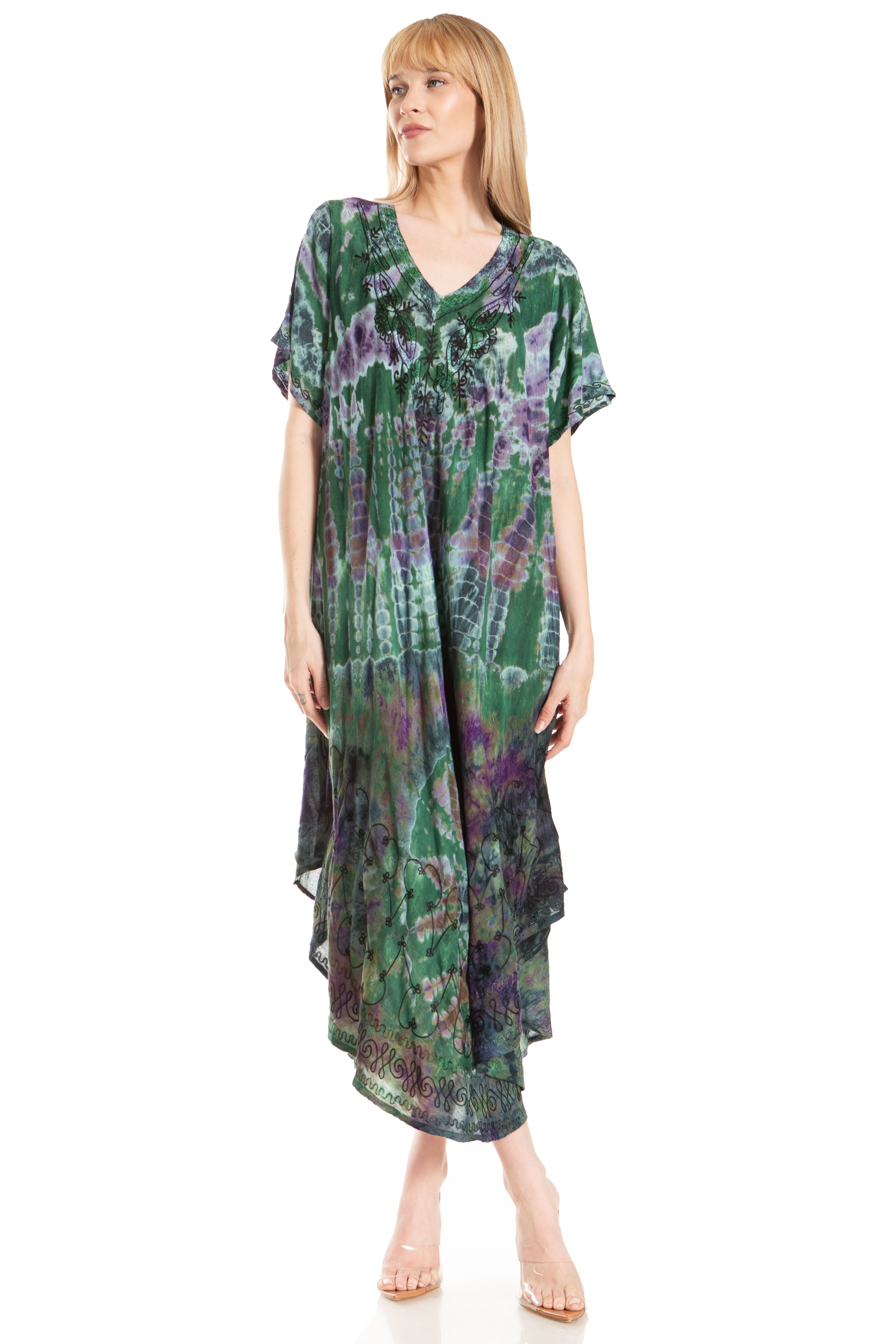 Woman wearing a green and purple patterned dress on a white background