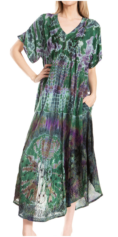 Woman wearing a green and purple patterned dress on a white background
