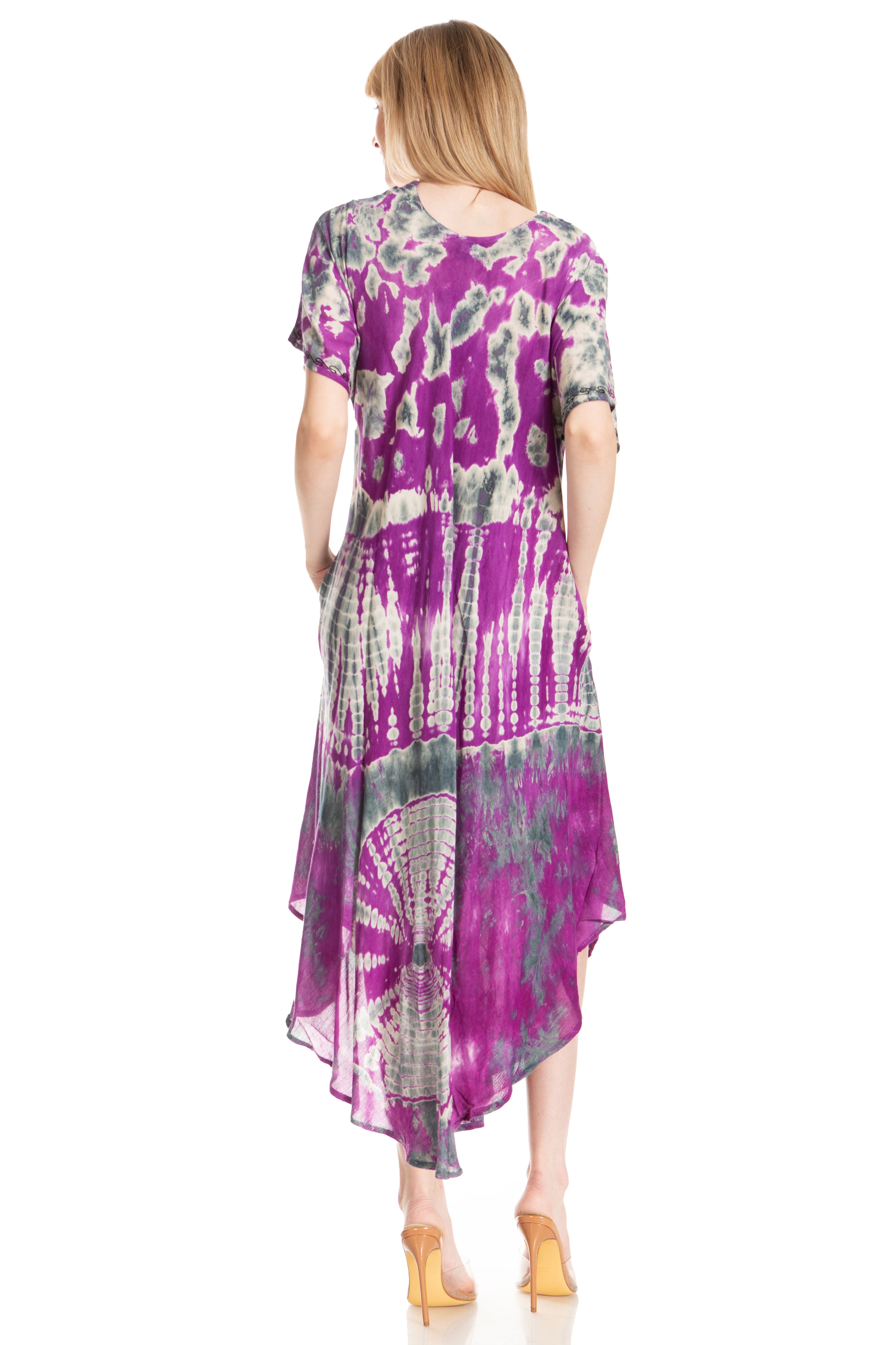 Woman wearing a tie-dye dress with a white background