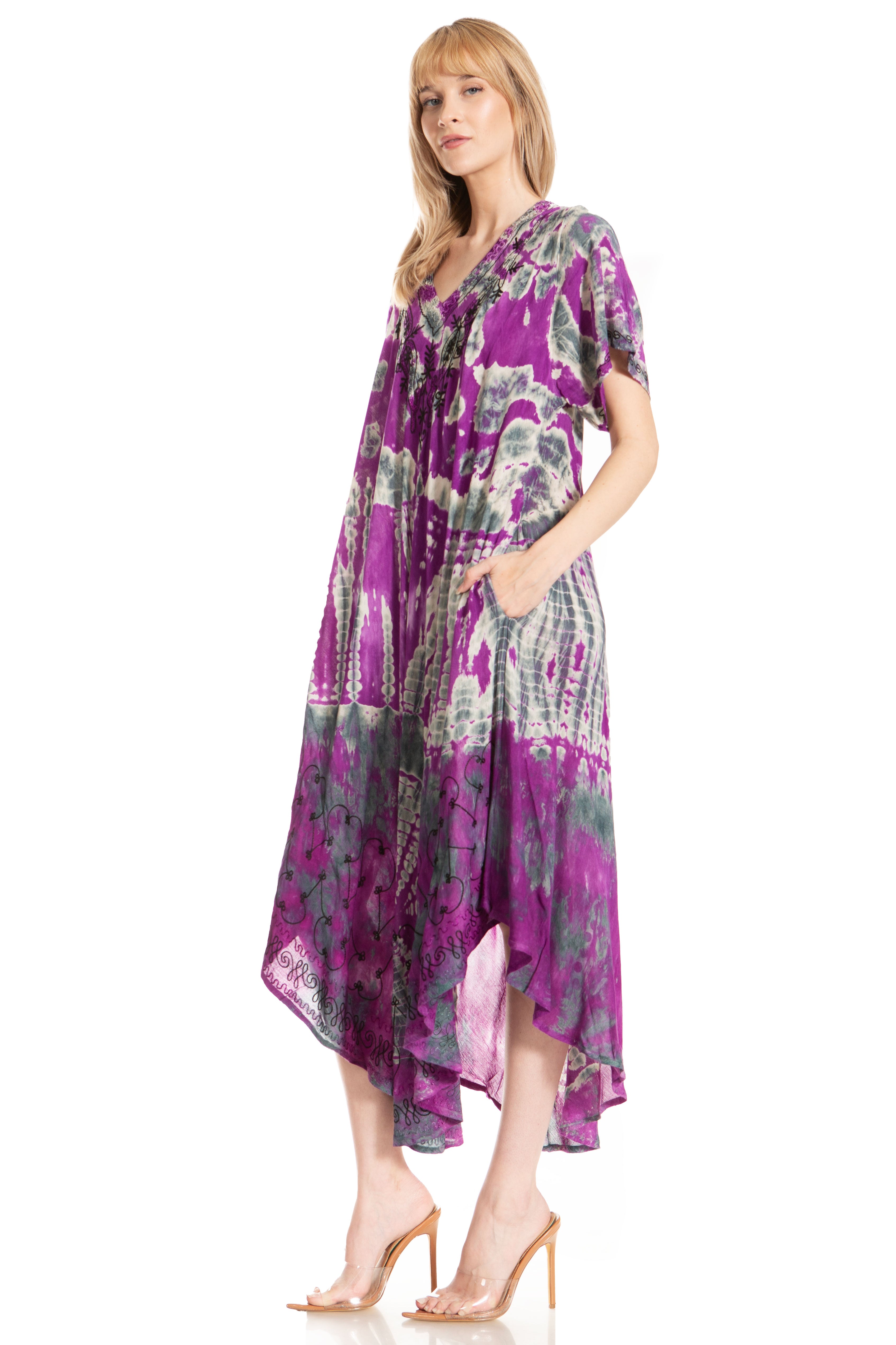 Woman wearing a purple floral dress on a white background