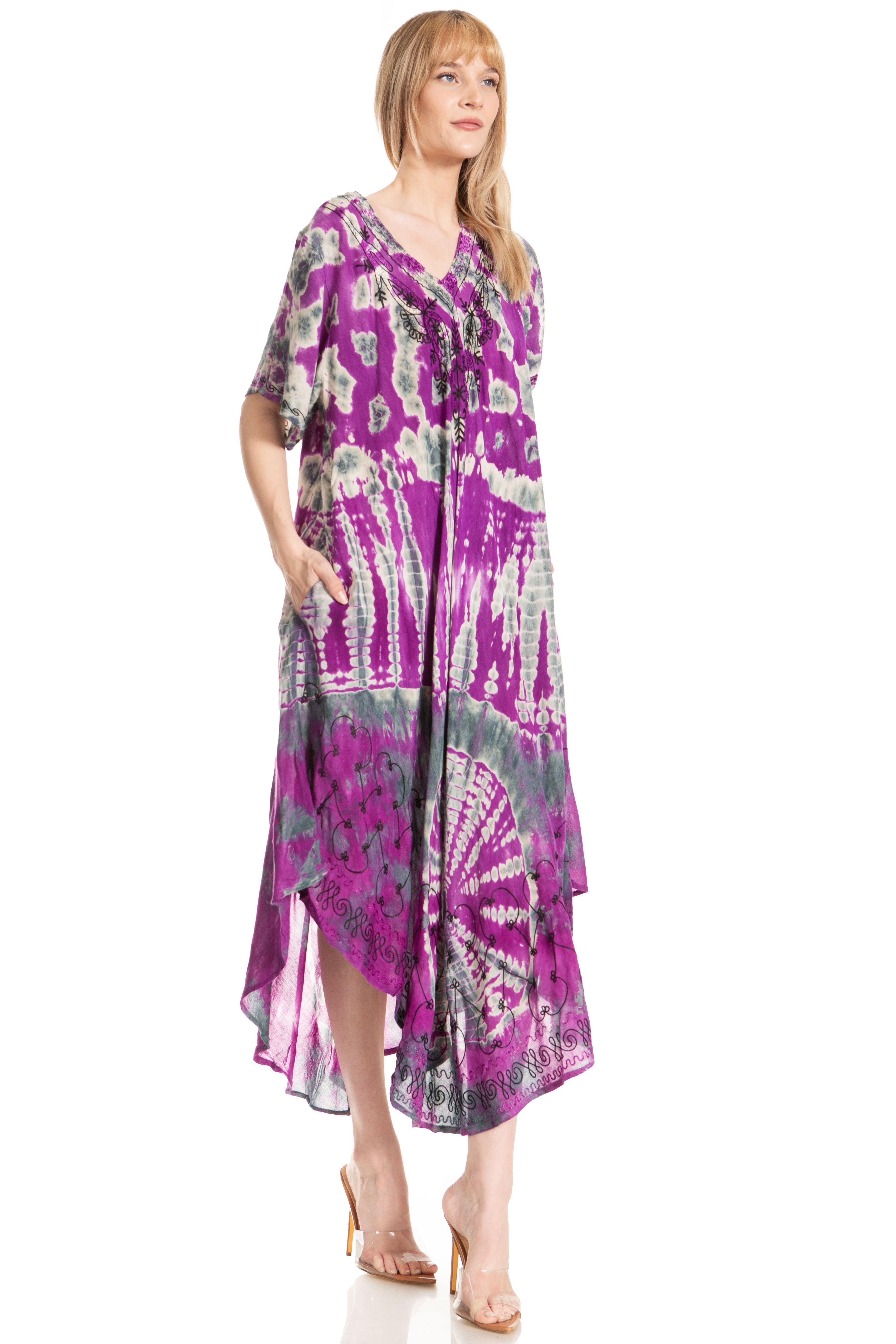 Woman wearing a purple tie-dye dress on a white background