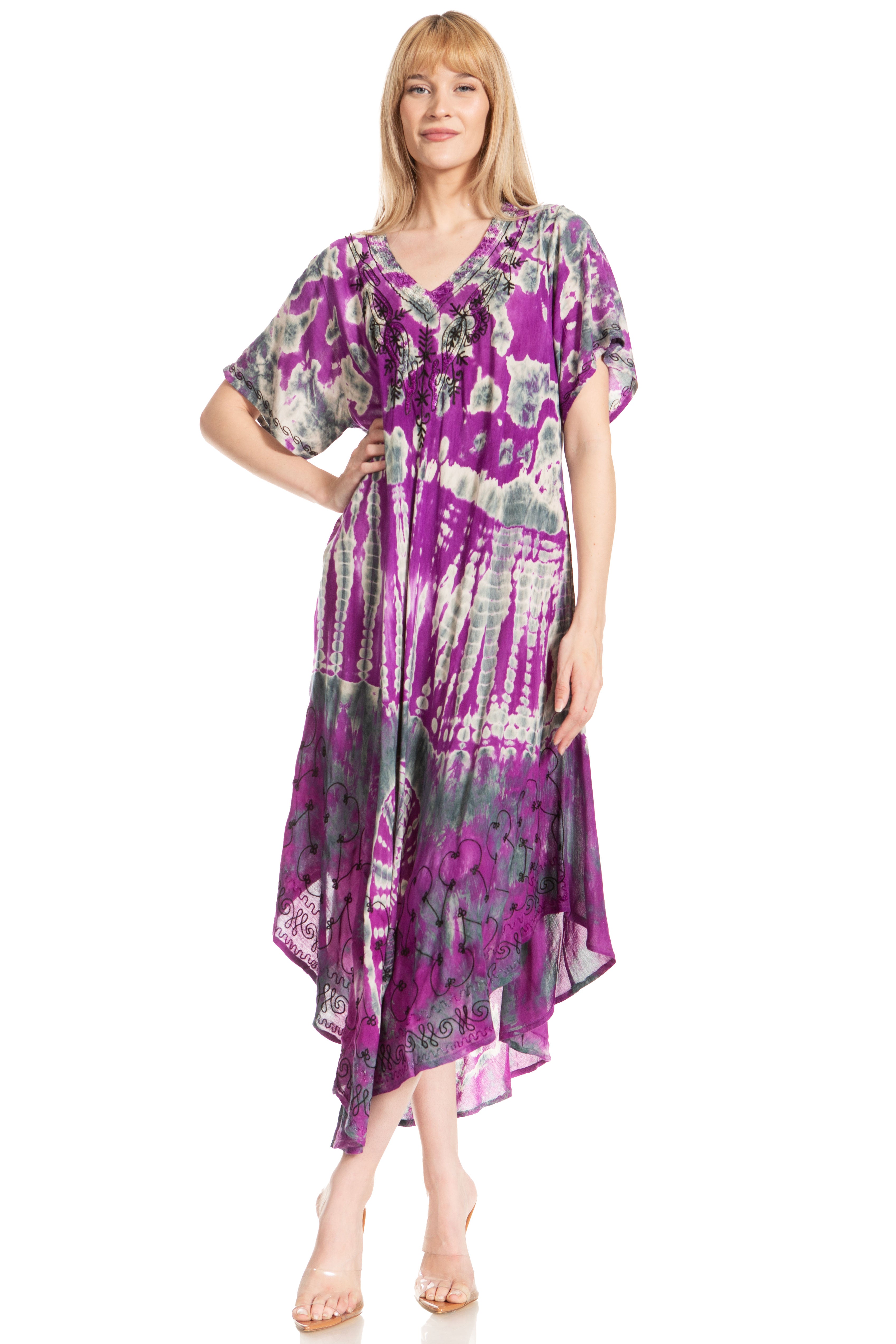 Woman wearing a purple floral dress on a white background