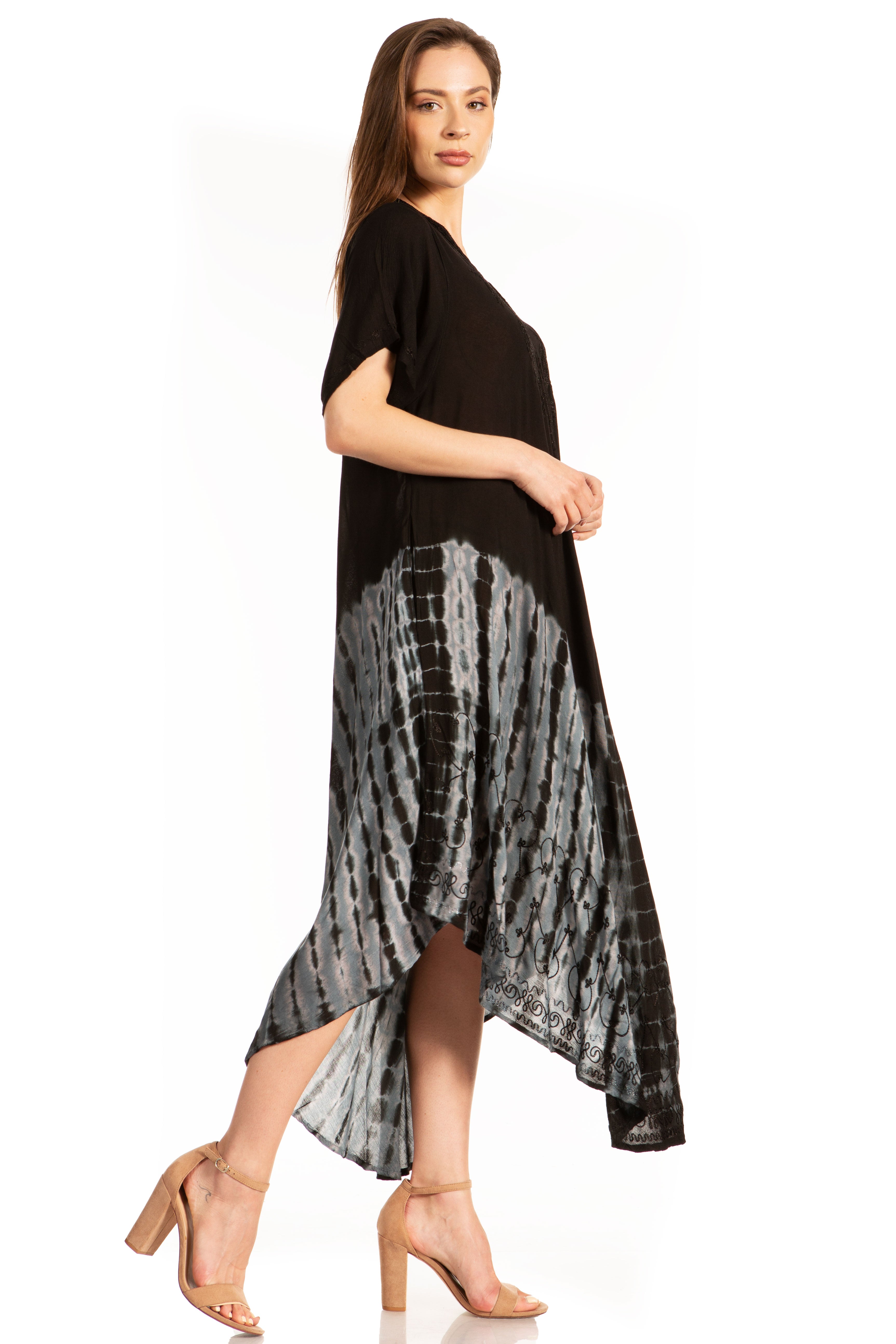 Woman wearing a black and gray tie-dye dress on a white background
