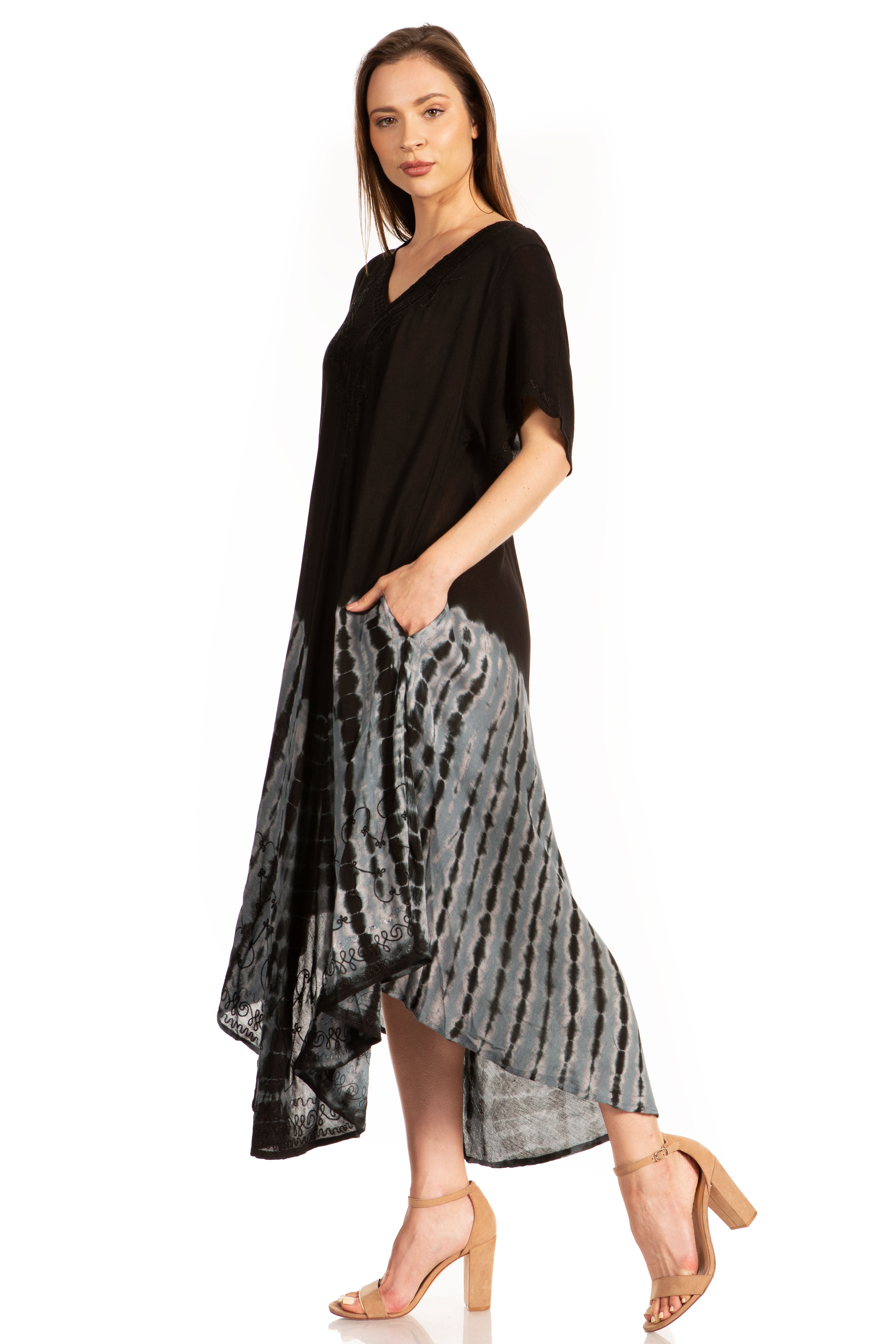 Woman wearing a black and gray patterned dress on a white background