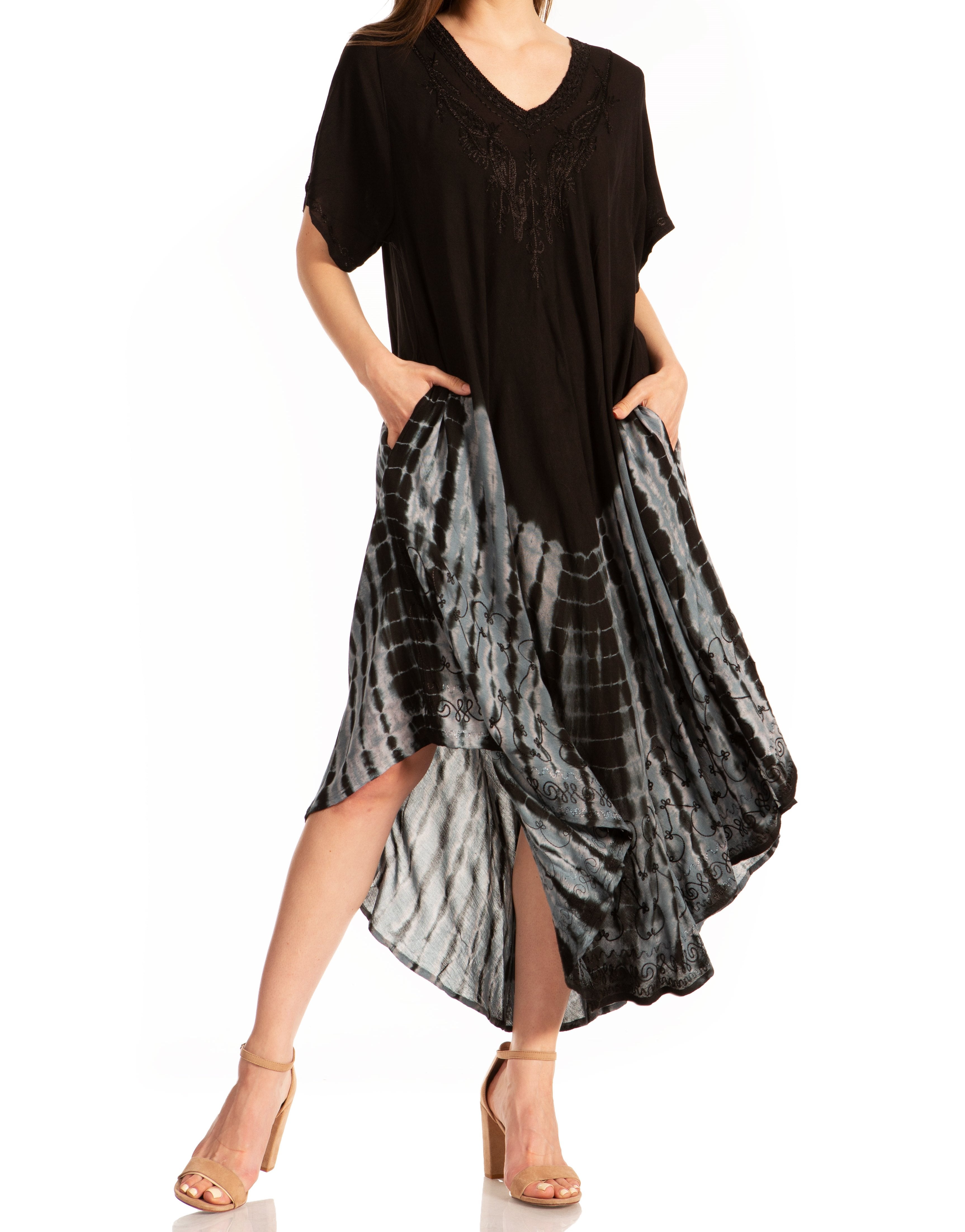 Woman wearing a black and gray patterned dress on a white background