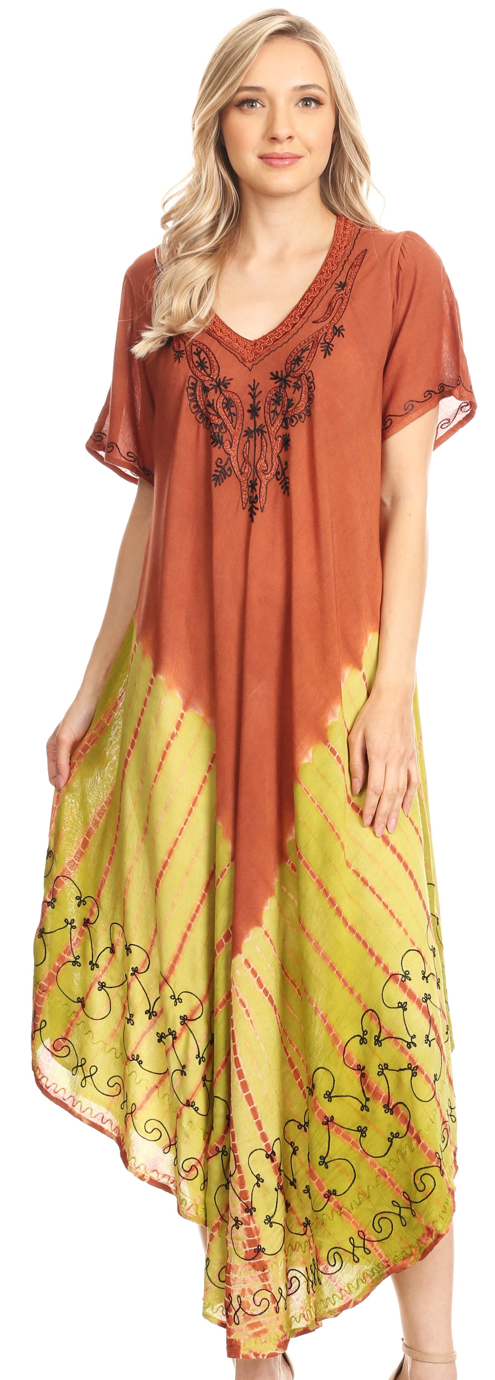 Woman wearing a long, patterned dress with a gradient from brown to green.