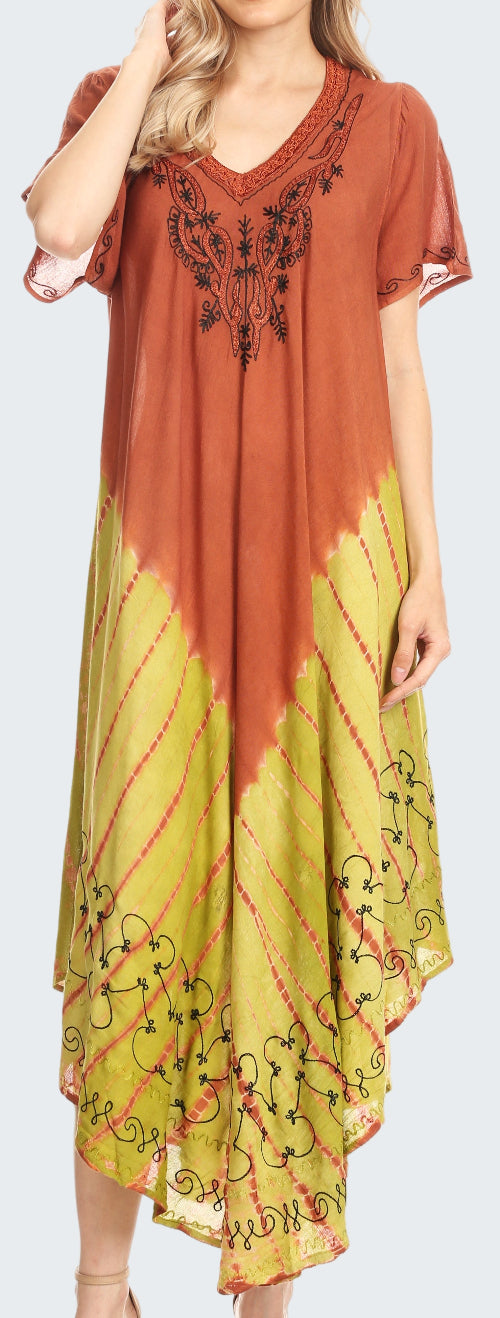 Woman wearing a rust and yellow dress with floral embroidery