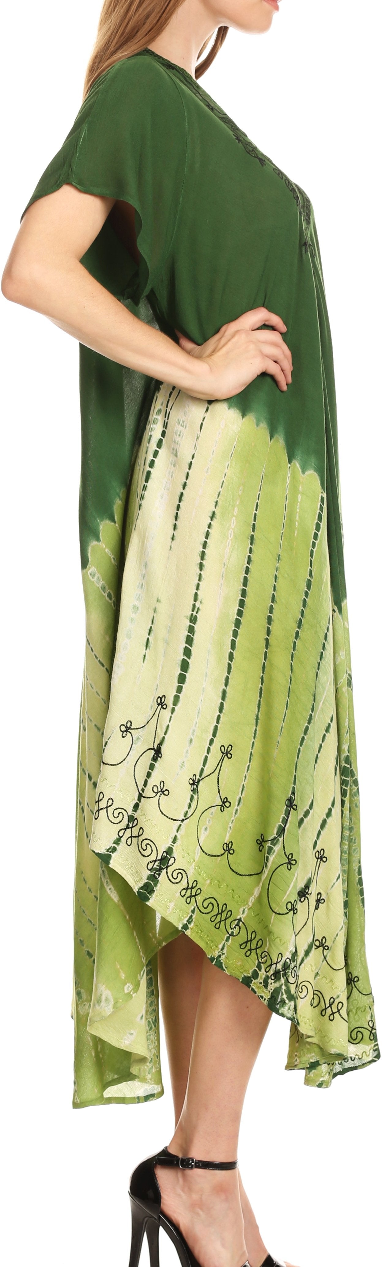 Green and white tie-dye dress with floral patterns on a plain background