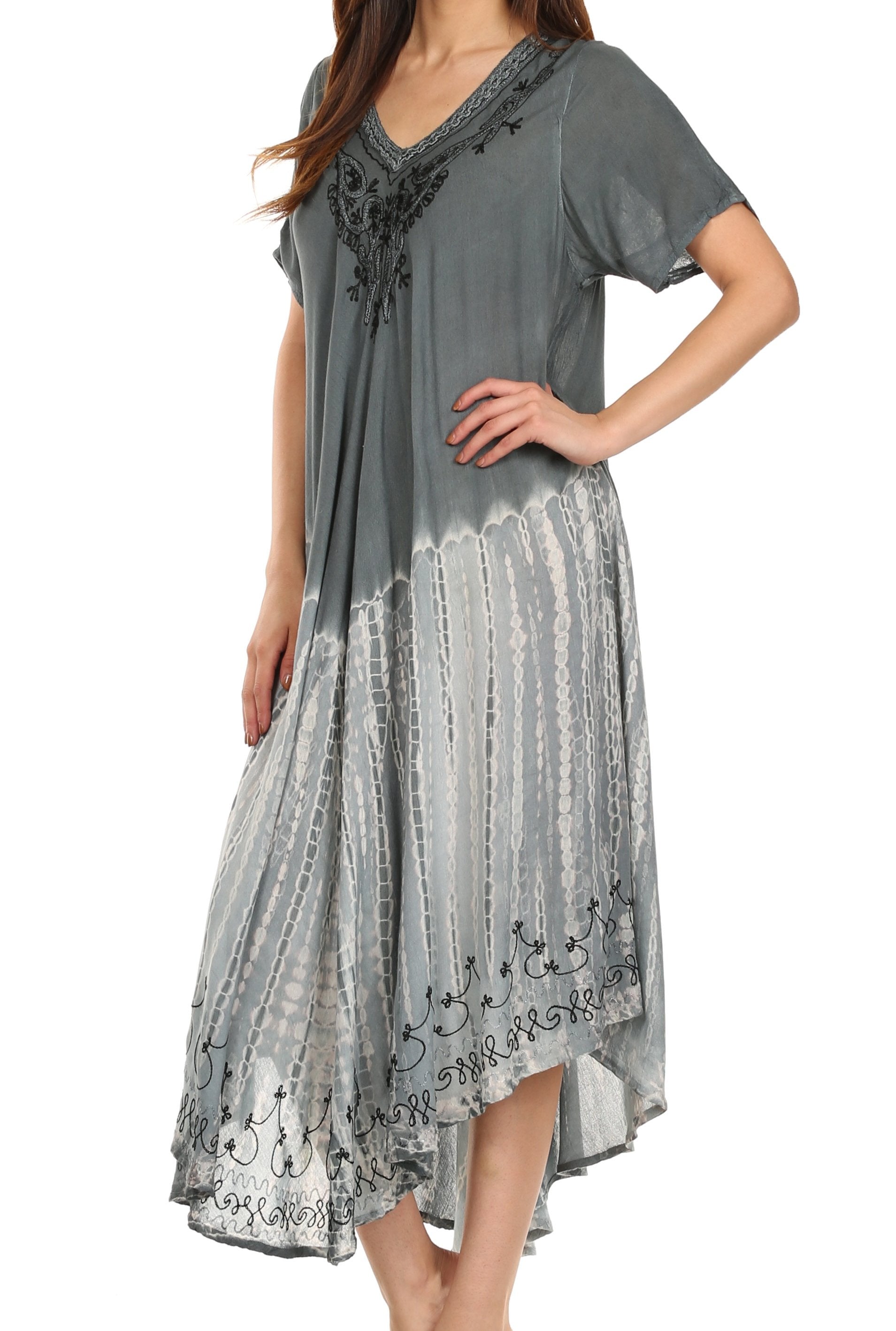 Woman wearing a gray dress with lace details on a white background