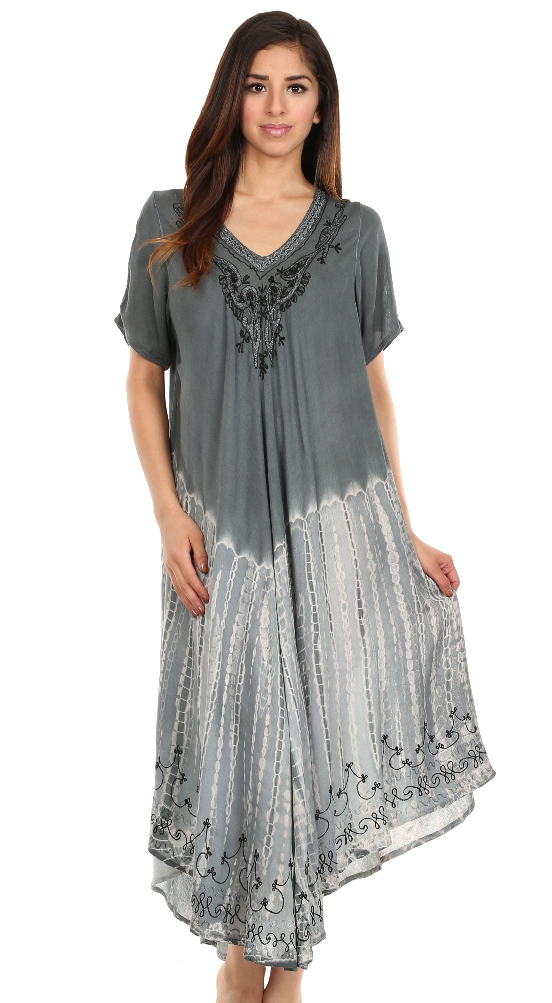 Woman wearing a gray dress with lace details on a white background