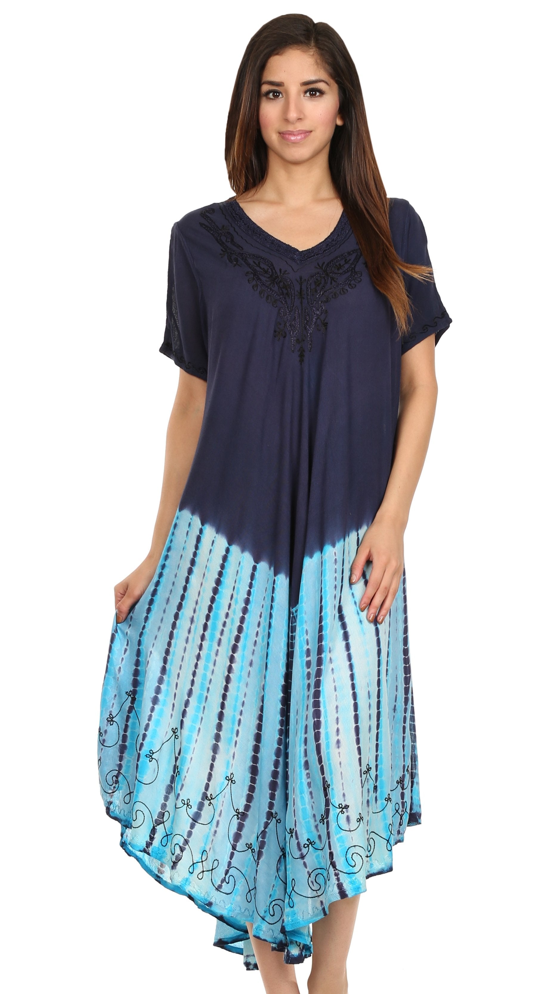 Woman wearing a navy blue and blue tie-dye dress on a white background