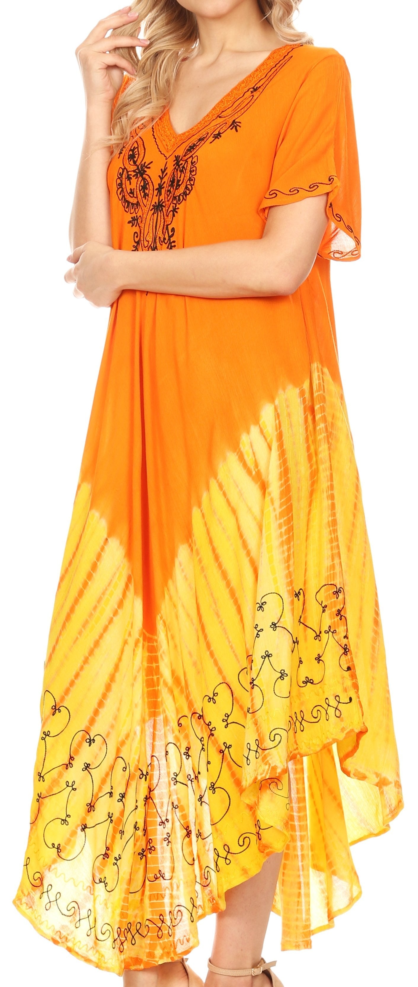 Orange and yellow dress with floral embroidery on a plain background