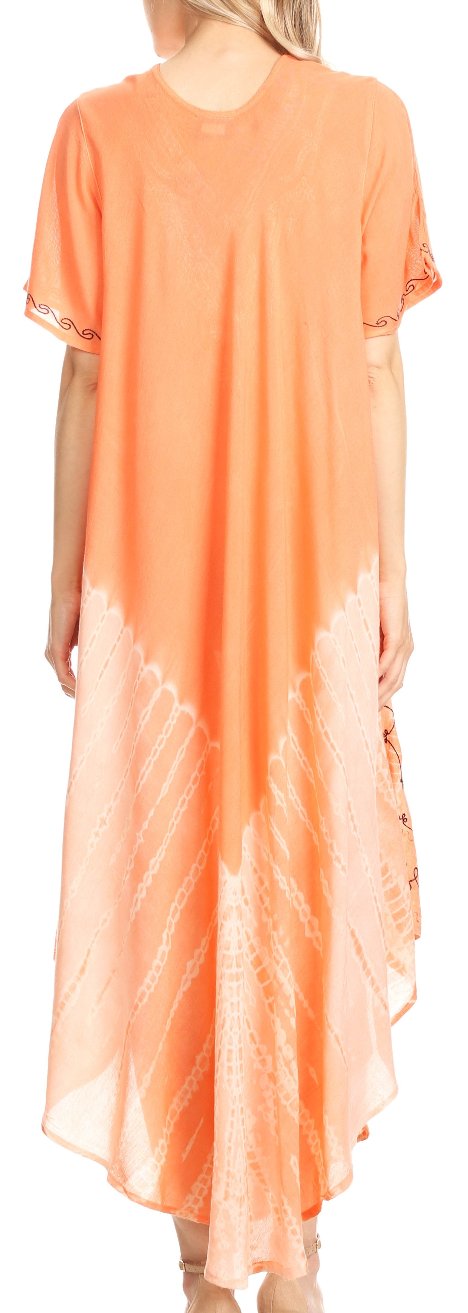 Woman wearing an orange tie-dye dress with a blurred background
