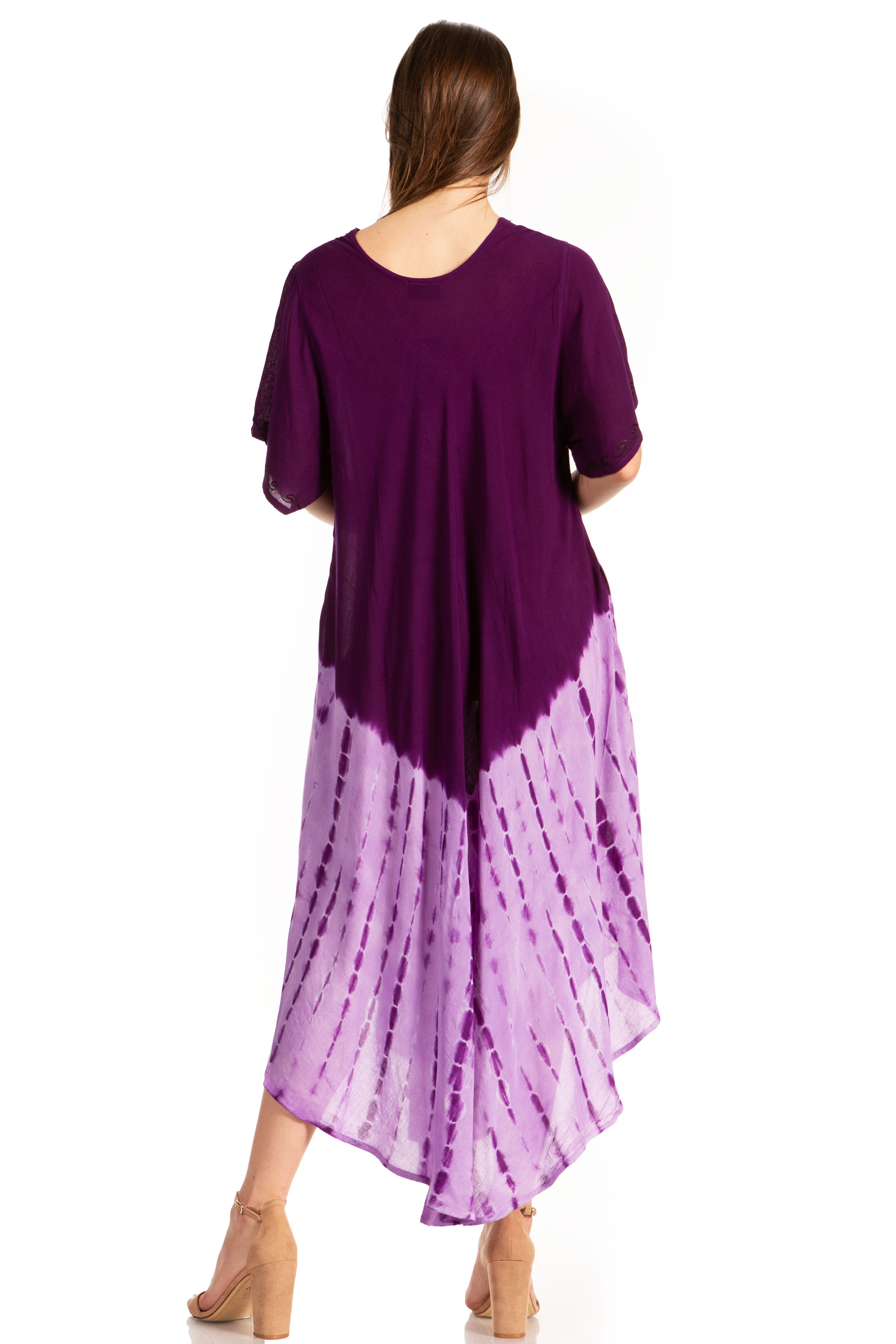 Woman wearing a purple dress with a tie-dye pattern on a white background