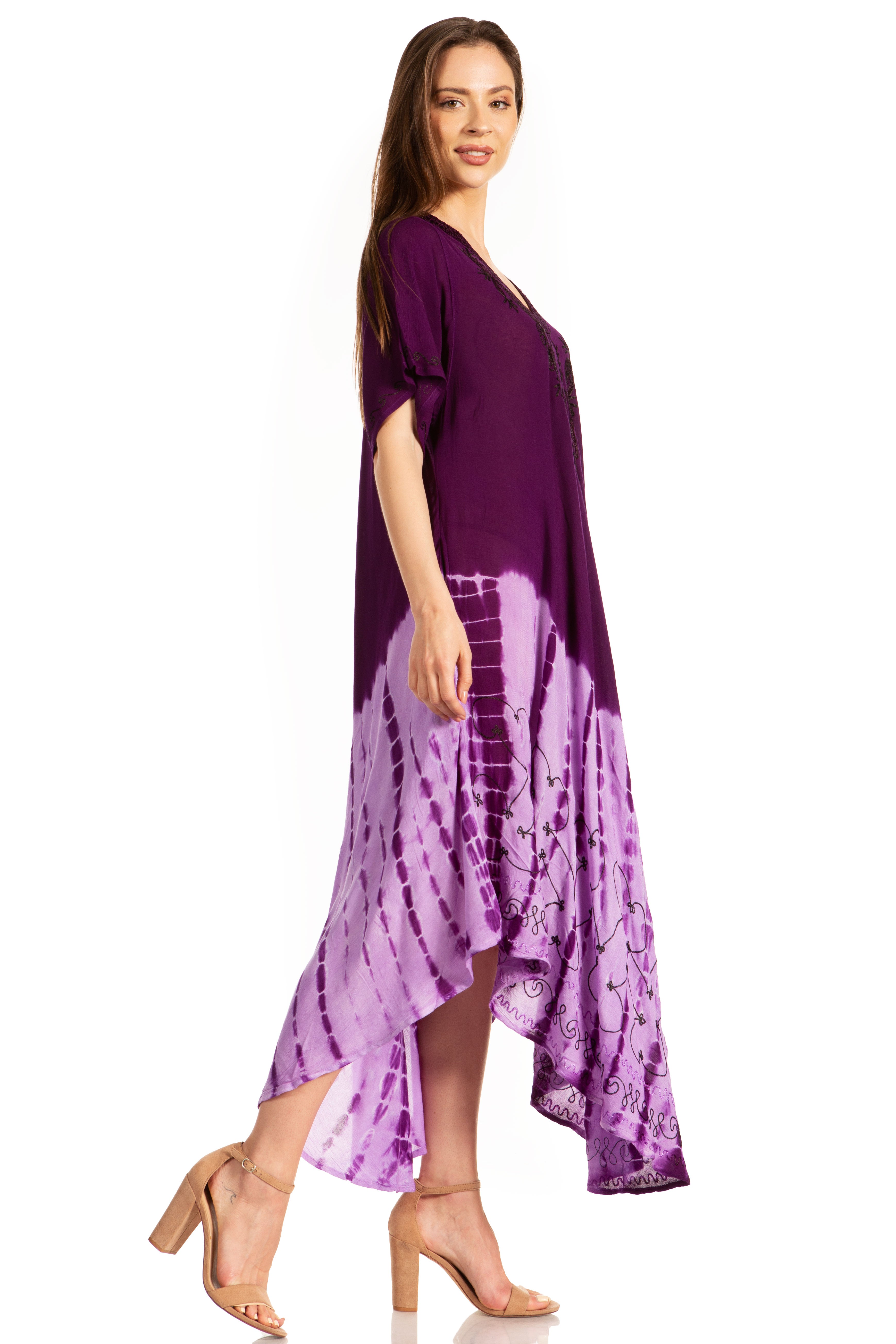 Woman wearing a purple dress with tie-dye pattern on a white background