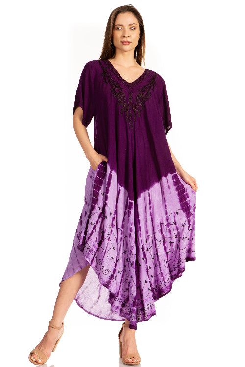 Woman wearing a purple dress with a tie-dye pattern on a white background