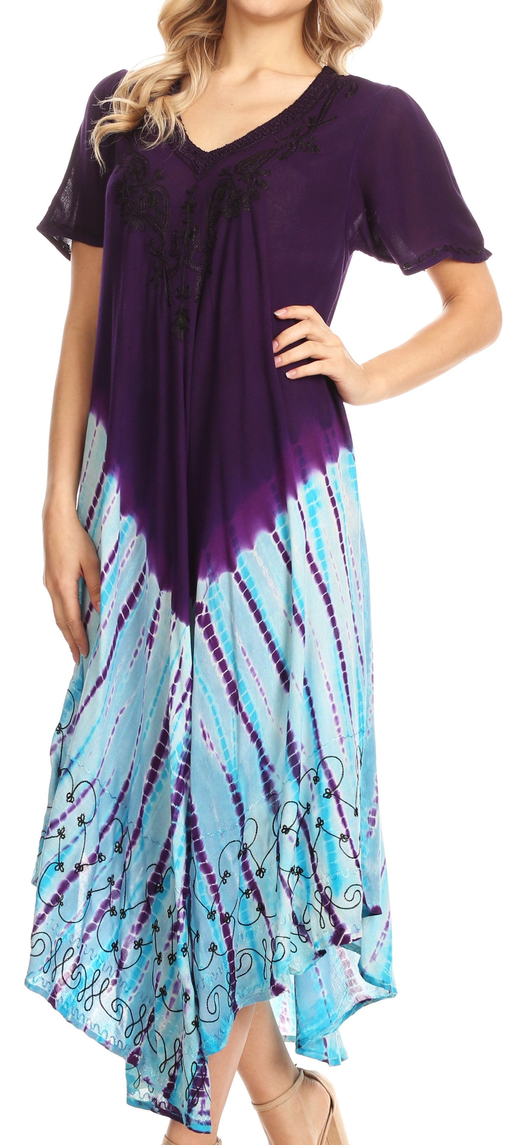 Woman wearing a purple and blue tie-dye dress with a flowing design.