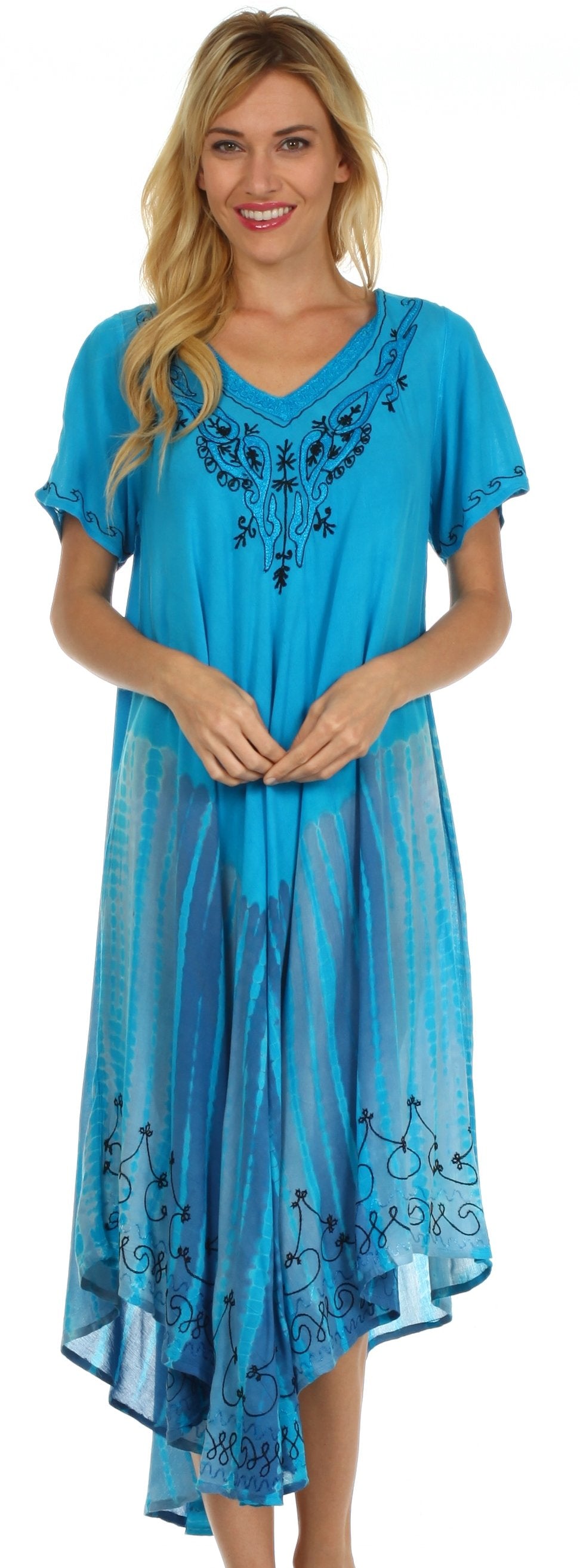 Woman wearing a blue dress with embroidery on a white background