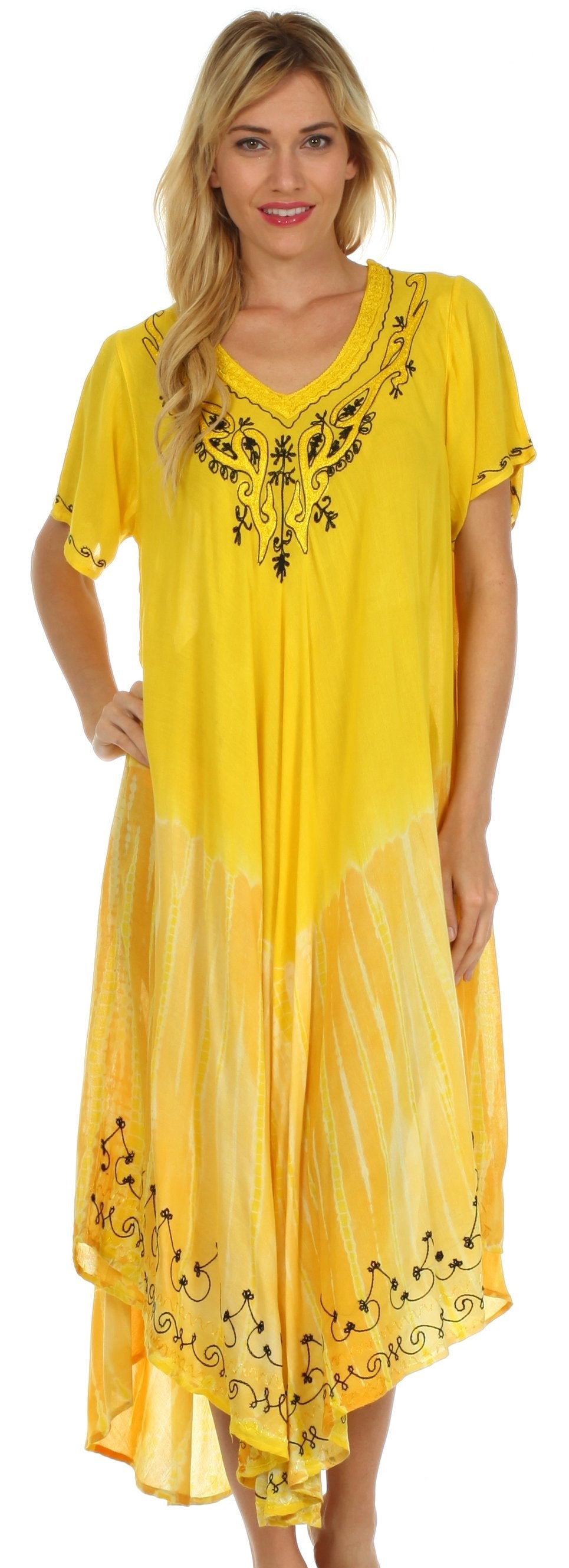 Woman wearing a yellow dress with black embroidery
