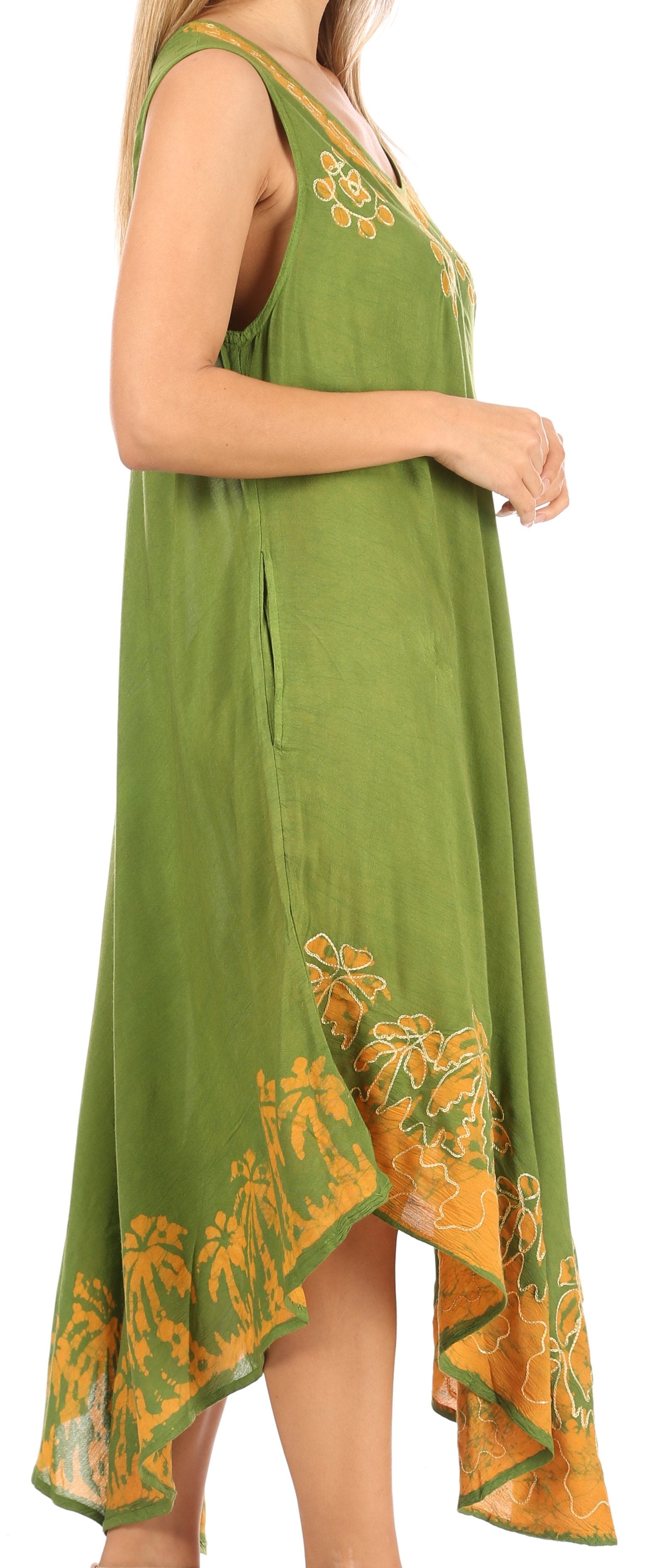 Green dress with yellow floral embroidery on a plain background