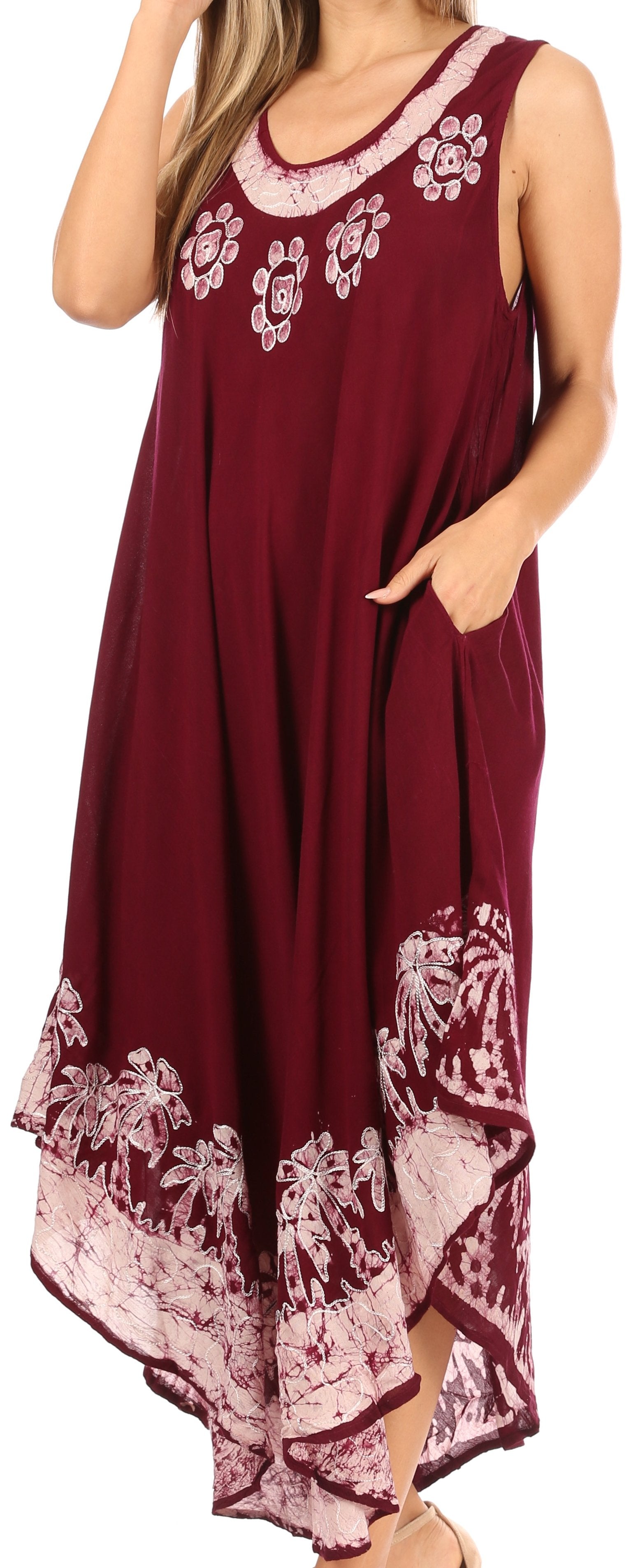 Woman wearing a burgundy sleeveless dress with floral embroidery