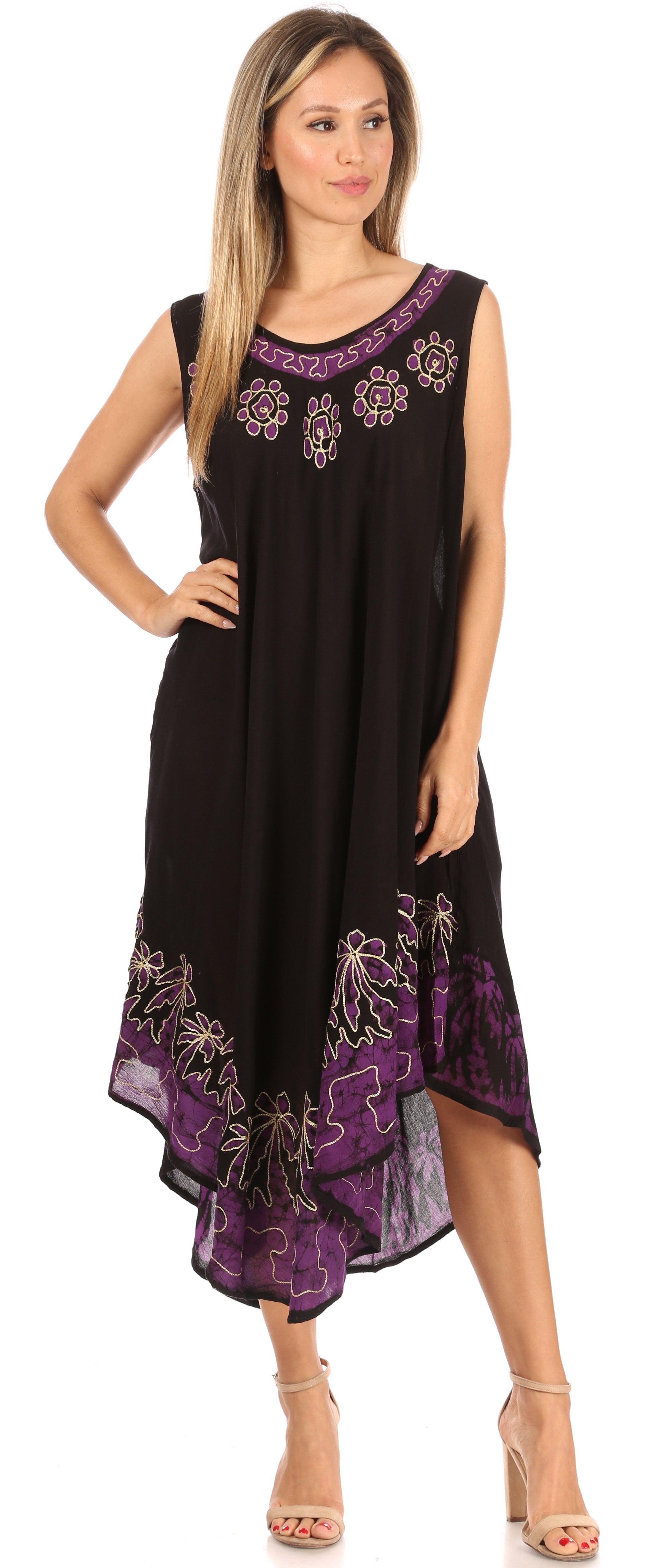 Woman wearing a black dress with purple floral embroidery on a white background