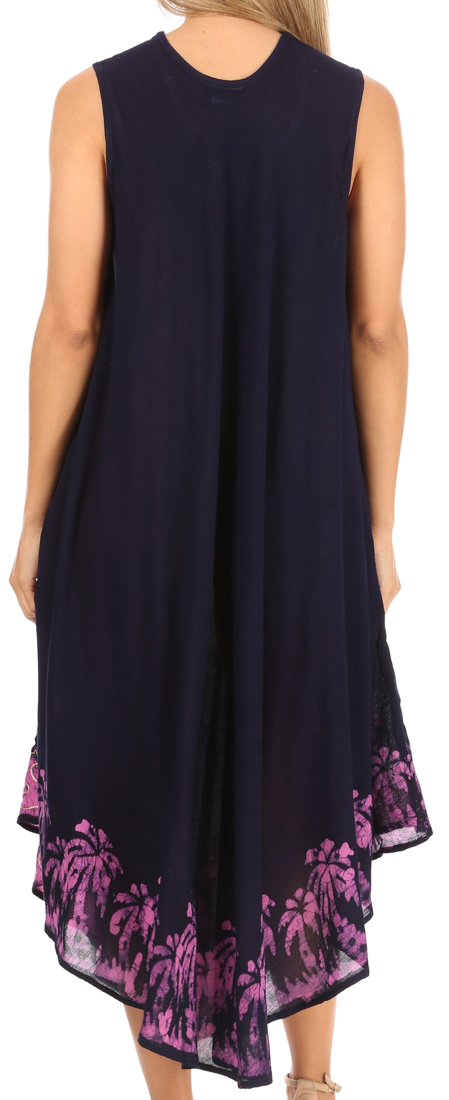 Navy sleeveless dress with pink floral pattern on the hem, worn by a person.