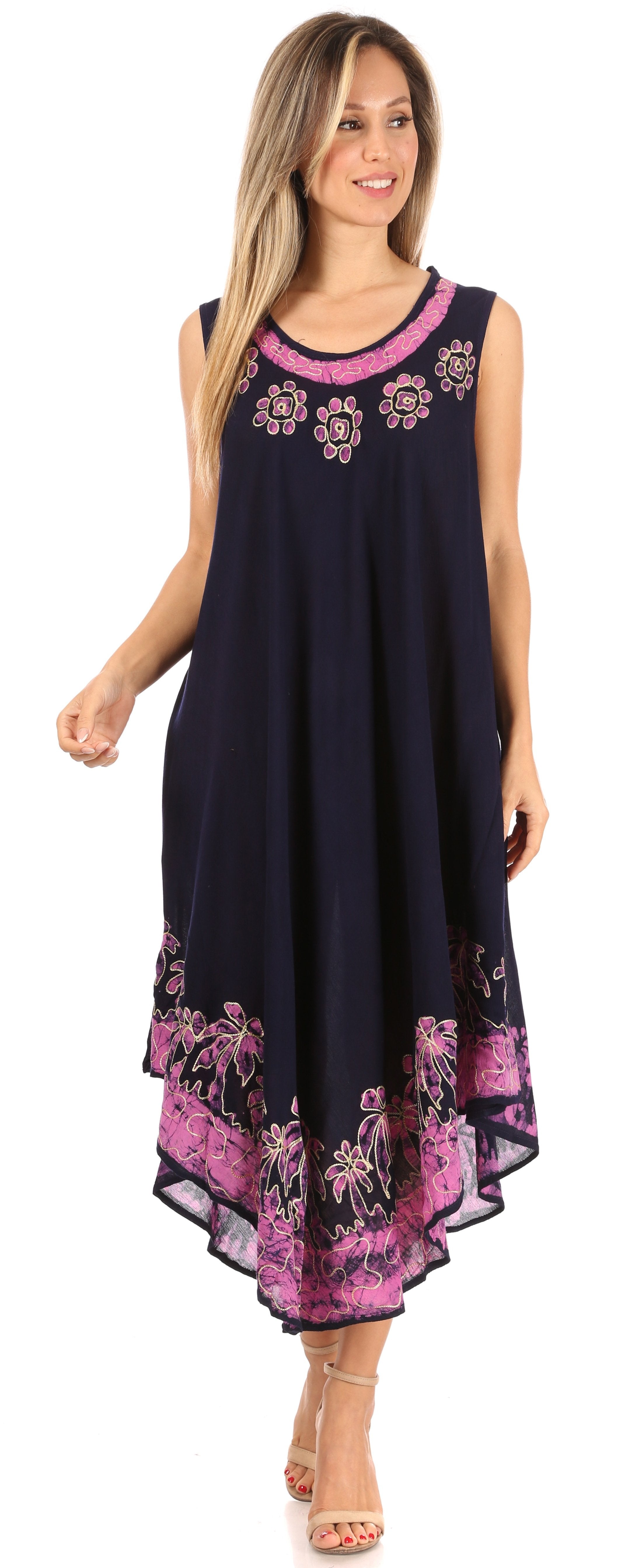 Woman wearing a navy dress with pink floral patterns on a white background