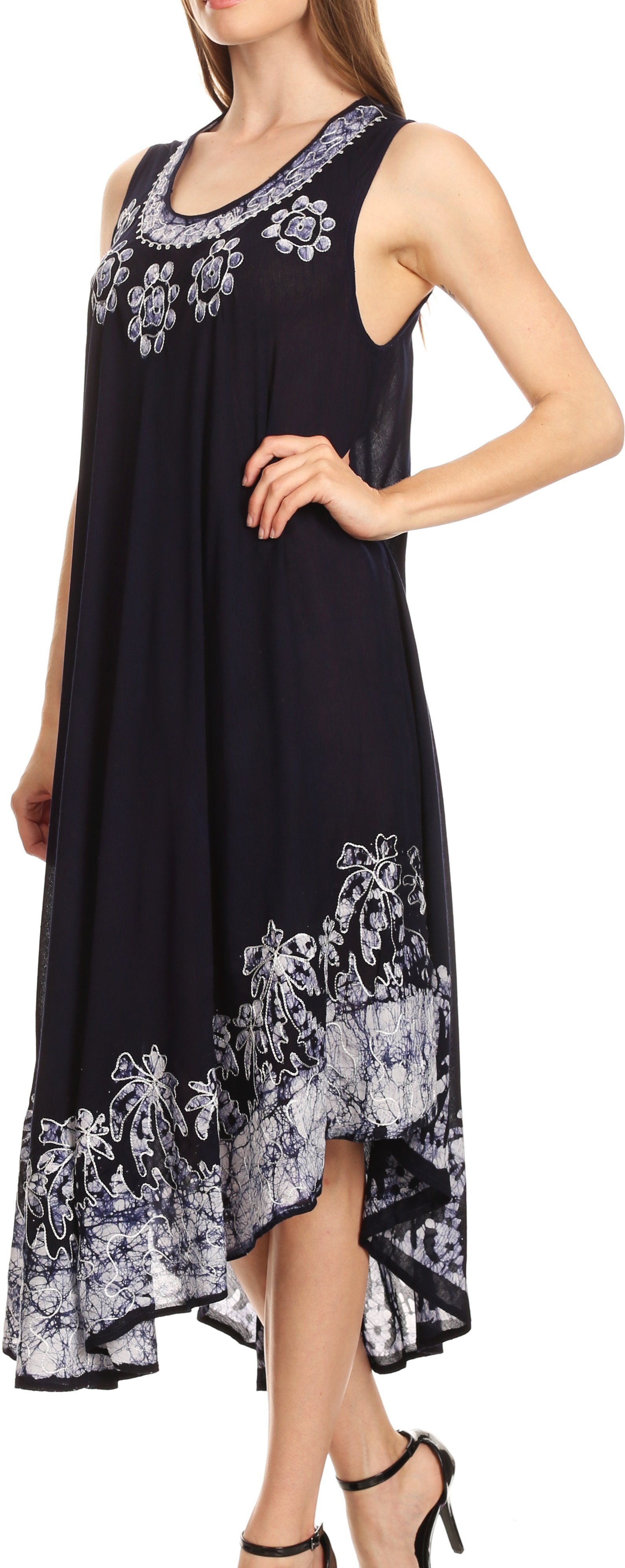 Woman wearing a black sleeveless dress with floral embroidery