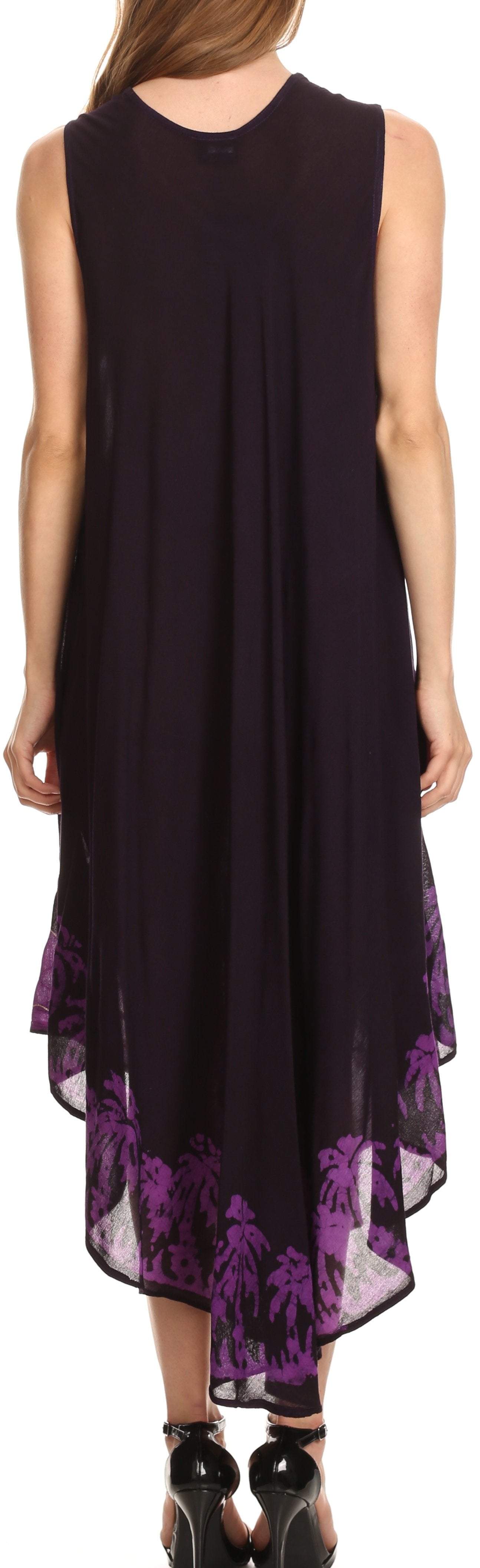 Black sleeveless dress with purple floral pattern at the bottom worn by a person.