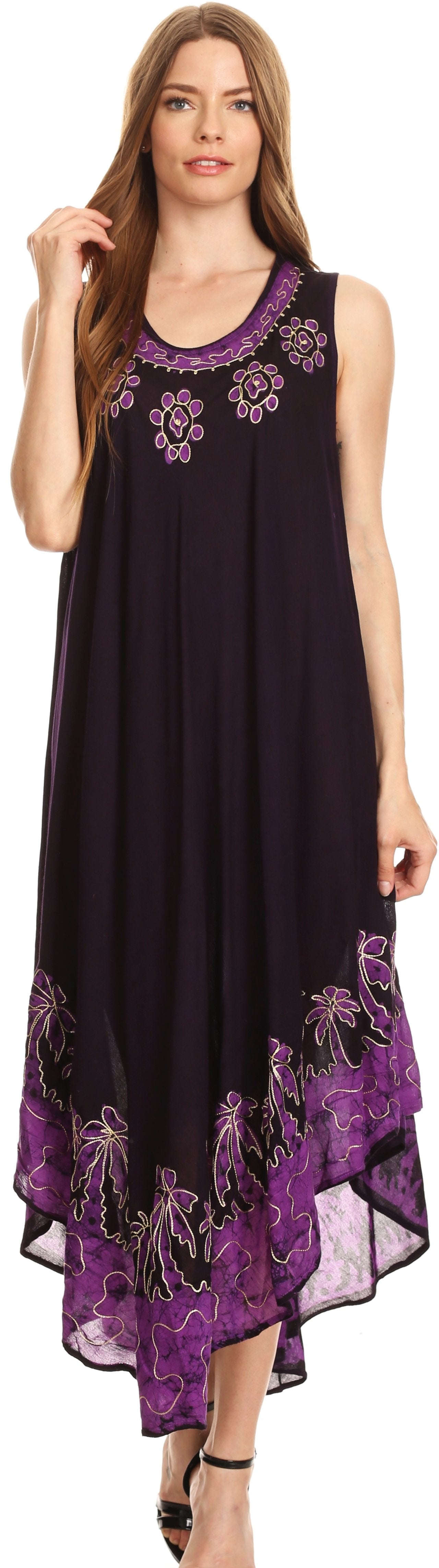Woman wearing a black sleeveless dress with purple floral embroidery.