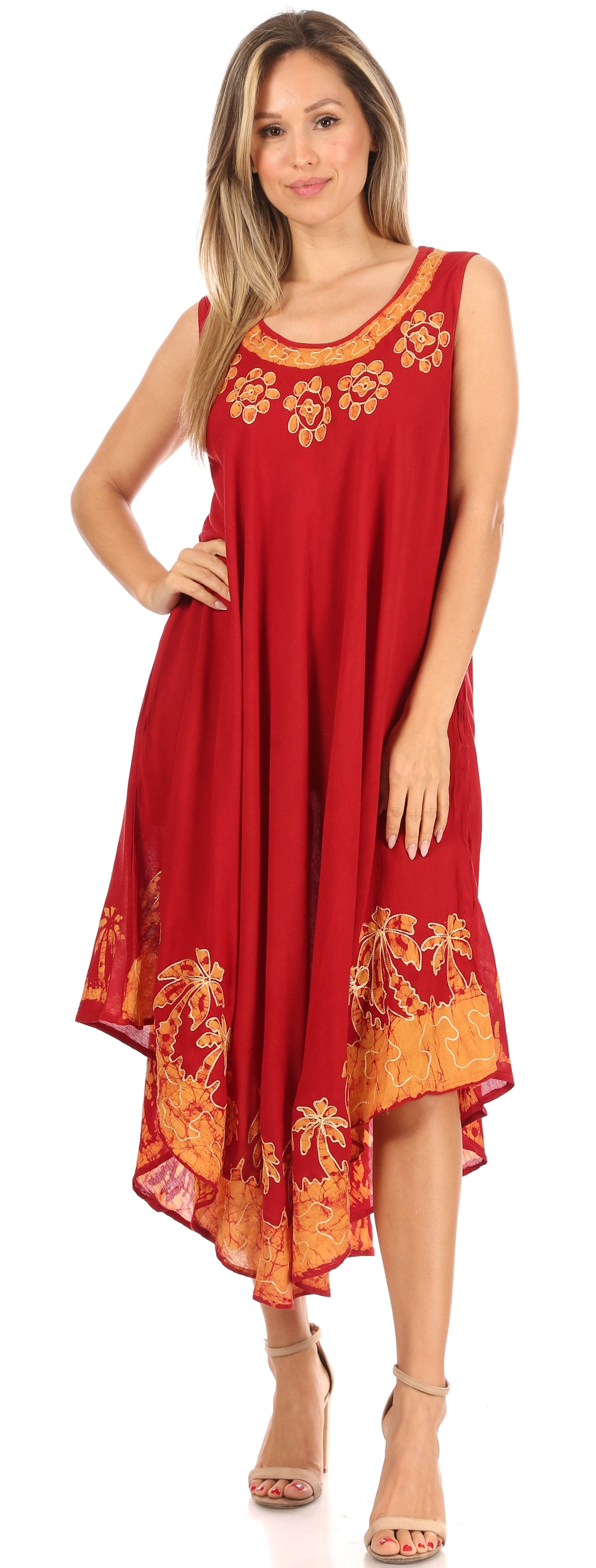 Woman wearing a red dress with floral patterns on a white background