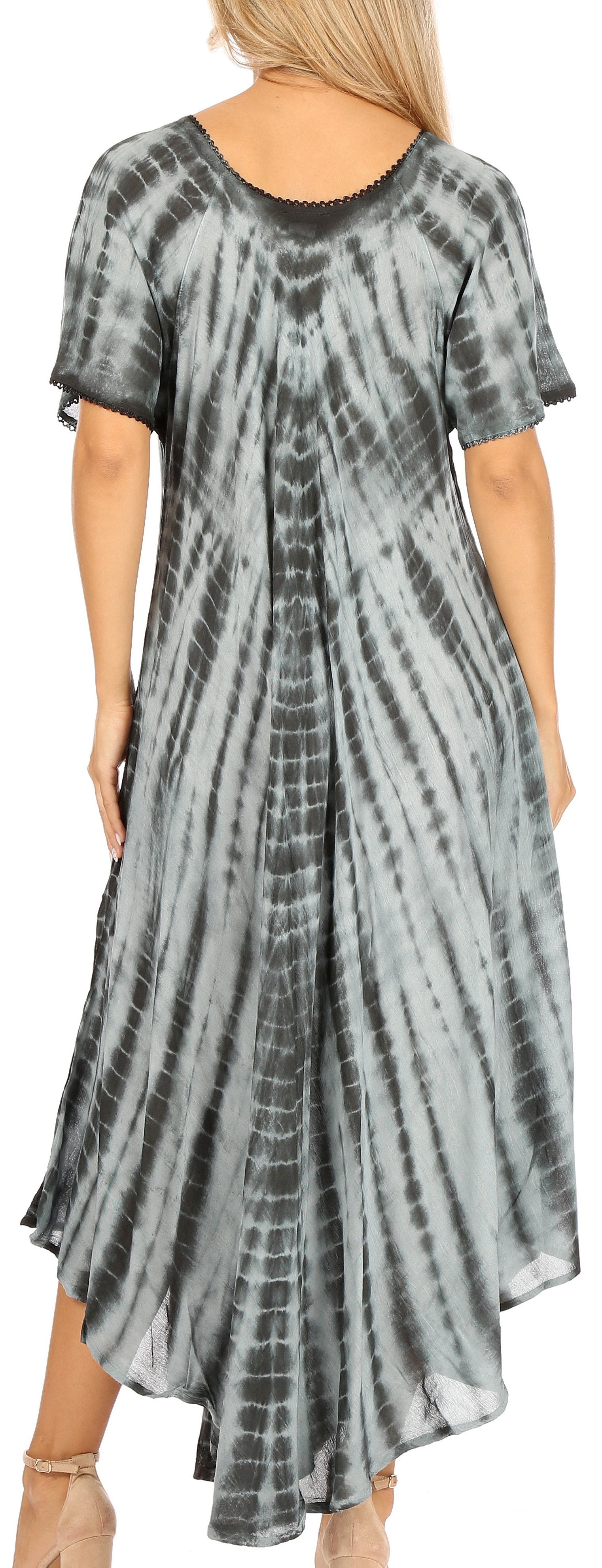 Woman wearing a tie-dye dress with a short front and long back.