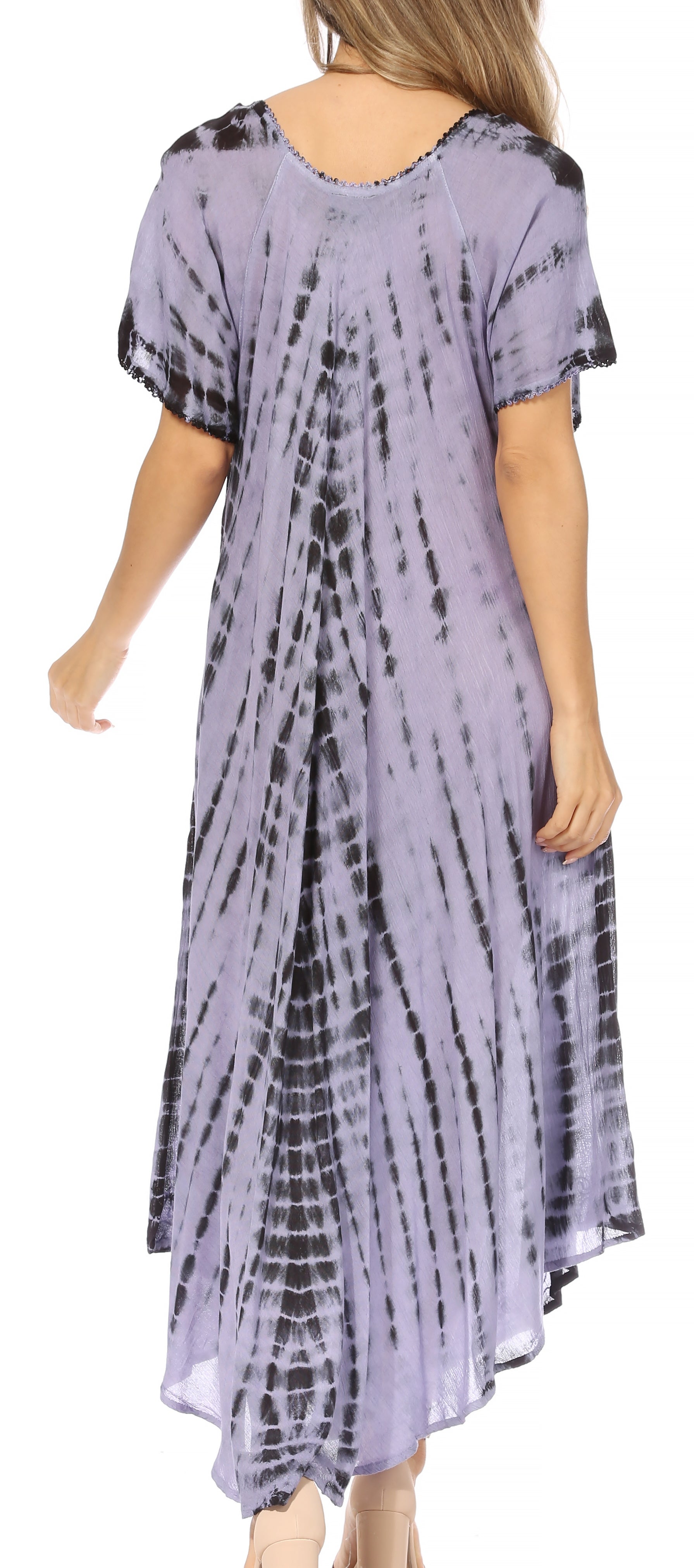 Woman wearing a tie-dye dress with a white background