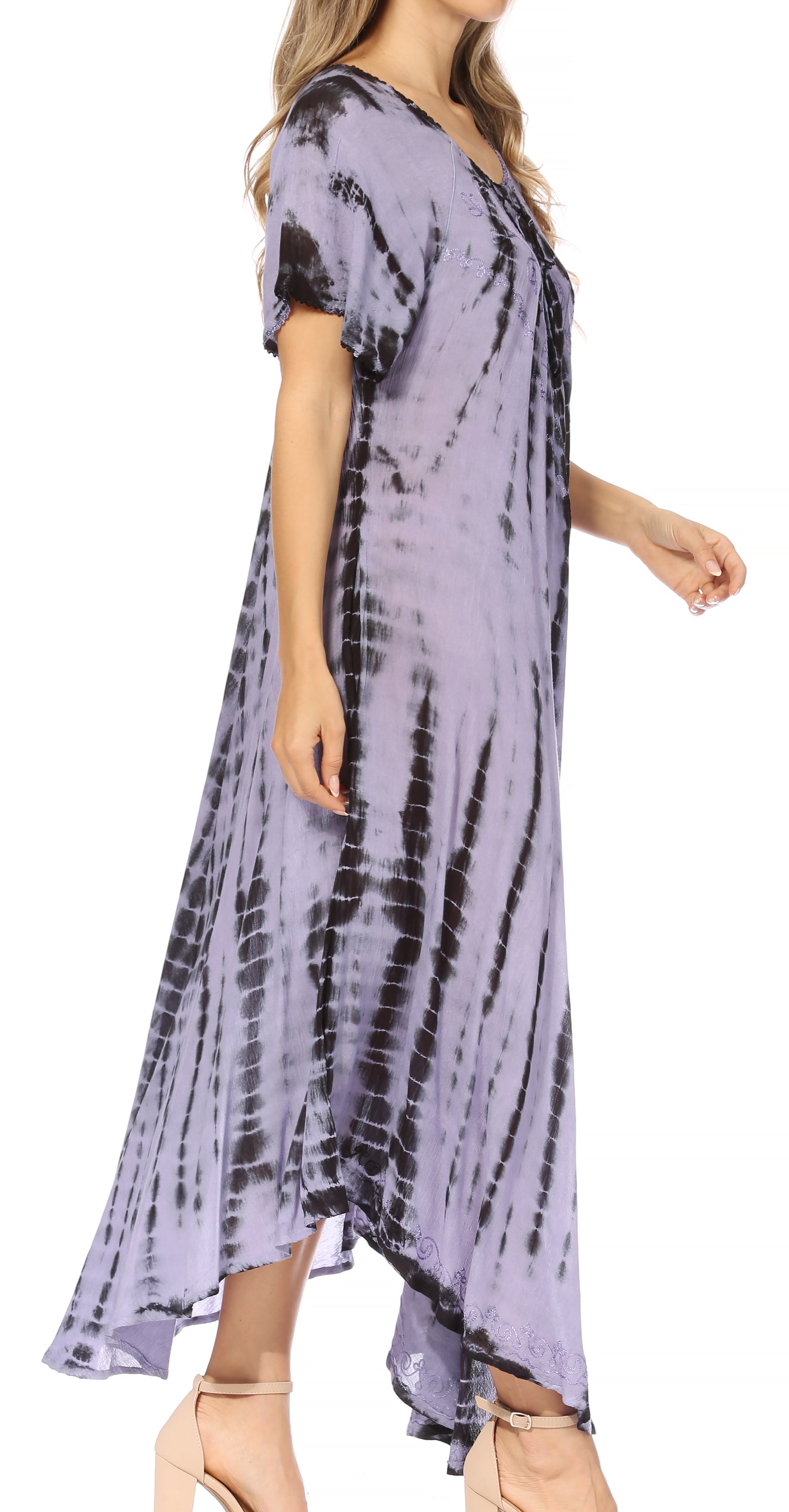 Woman wearing a tie-dye dress on a white background