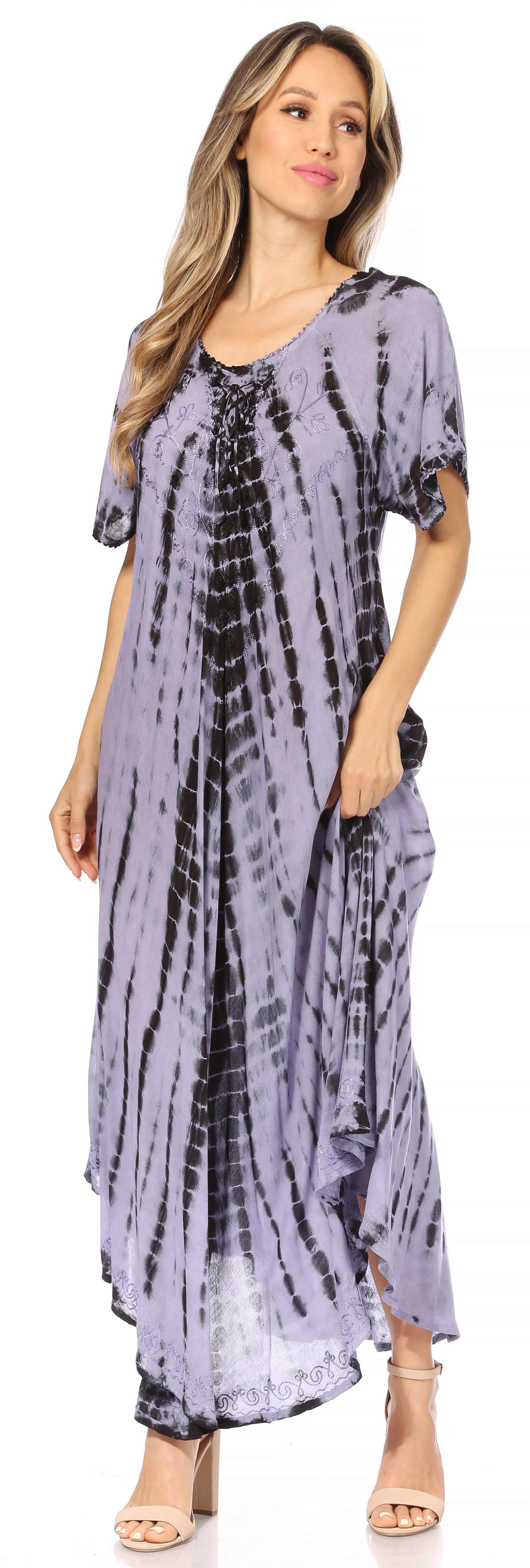 Woman wearing a tie-dye dress with a blurred background