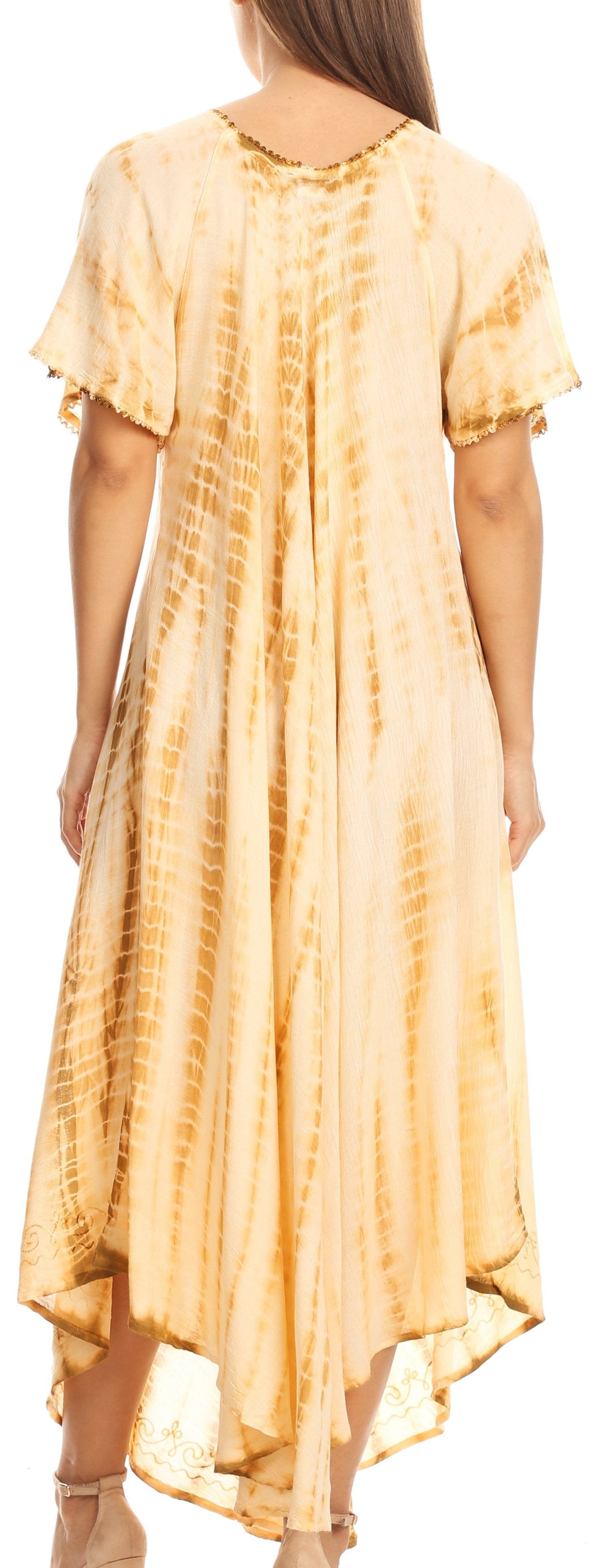 Woman wearing a yellow tie-dye dress with a plain background