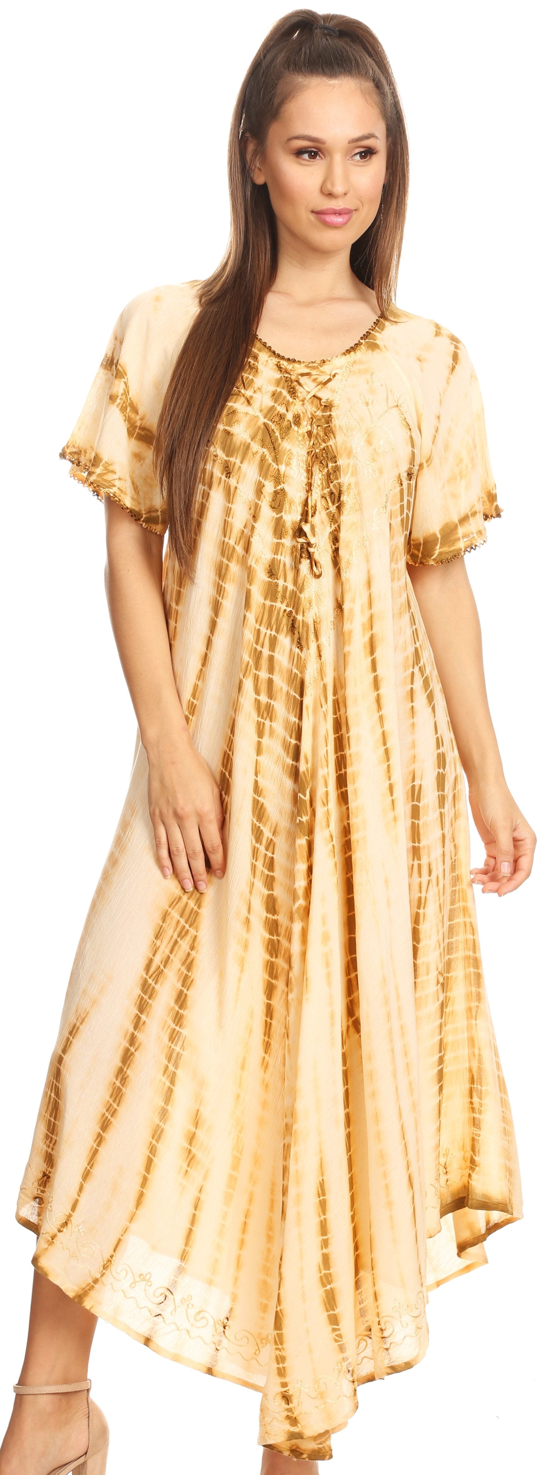 Woman wearing a yellow tie-dye dress on a white background