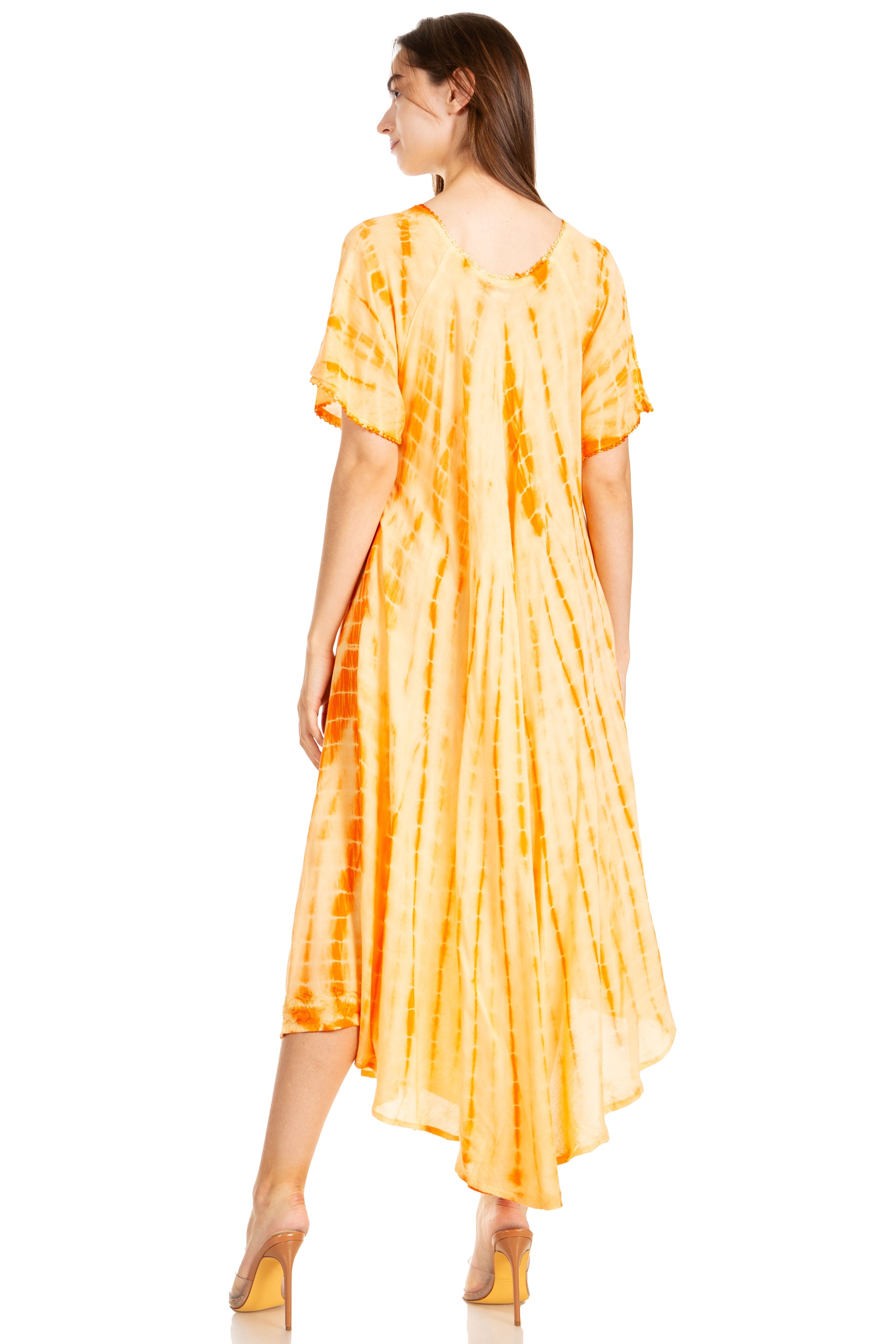 Woman wearing a yellow tie-dye dress on a white background