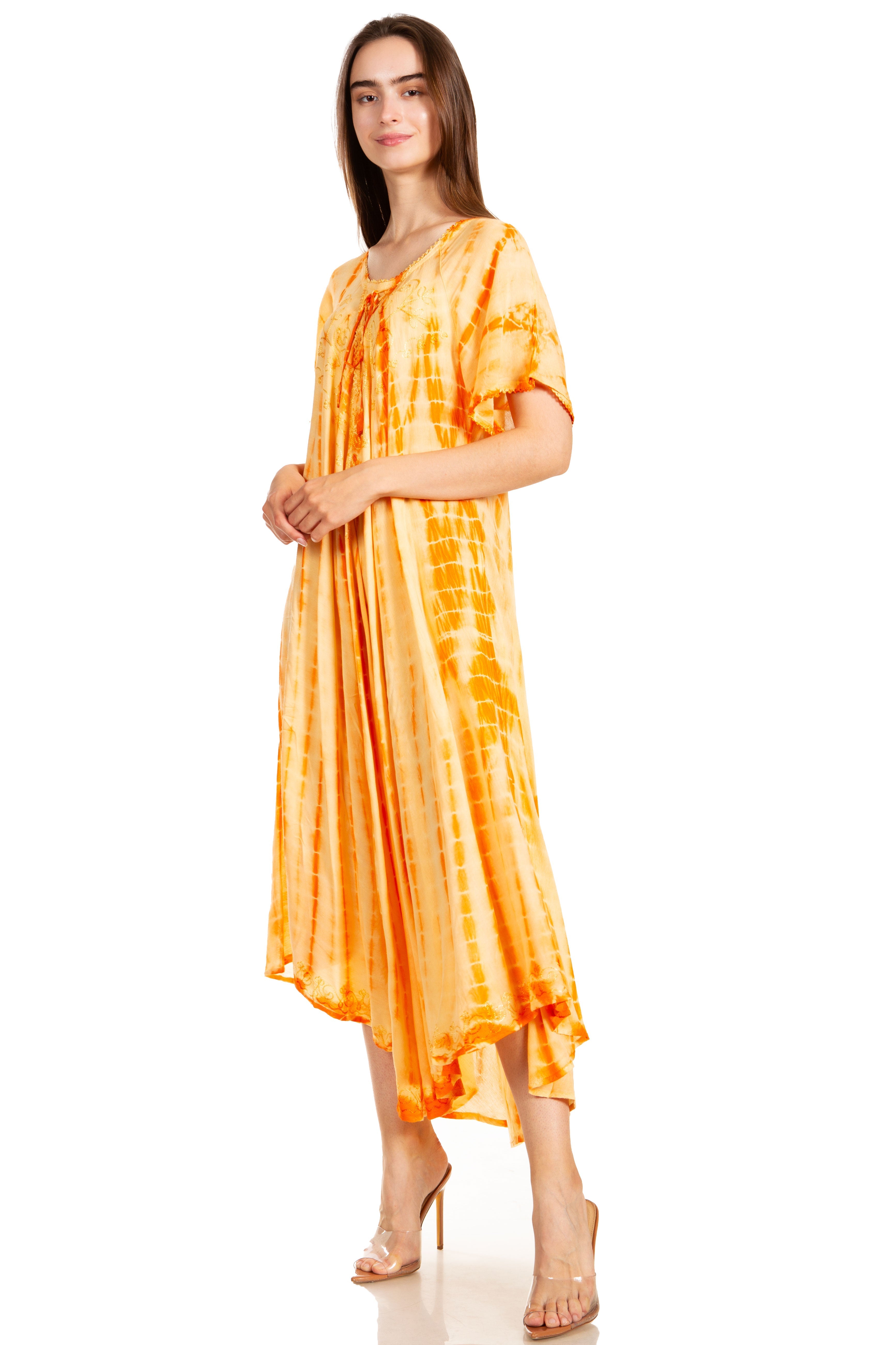Woman wearing a yellow tie-dye dress on a white background