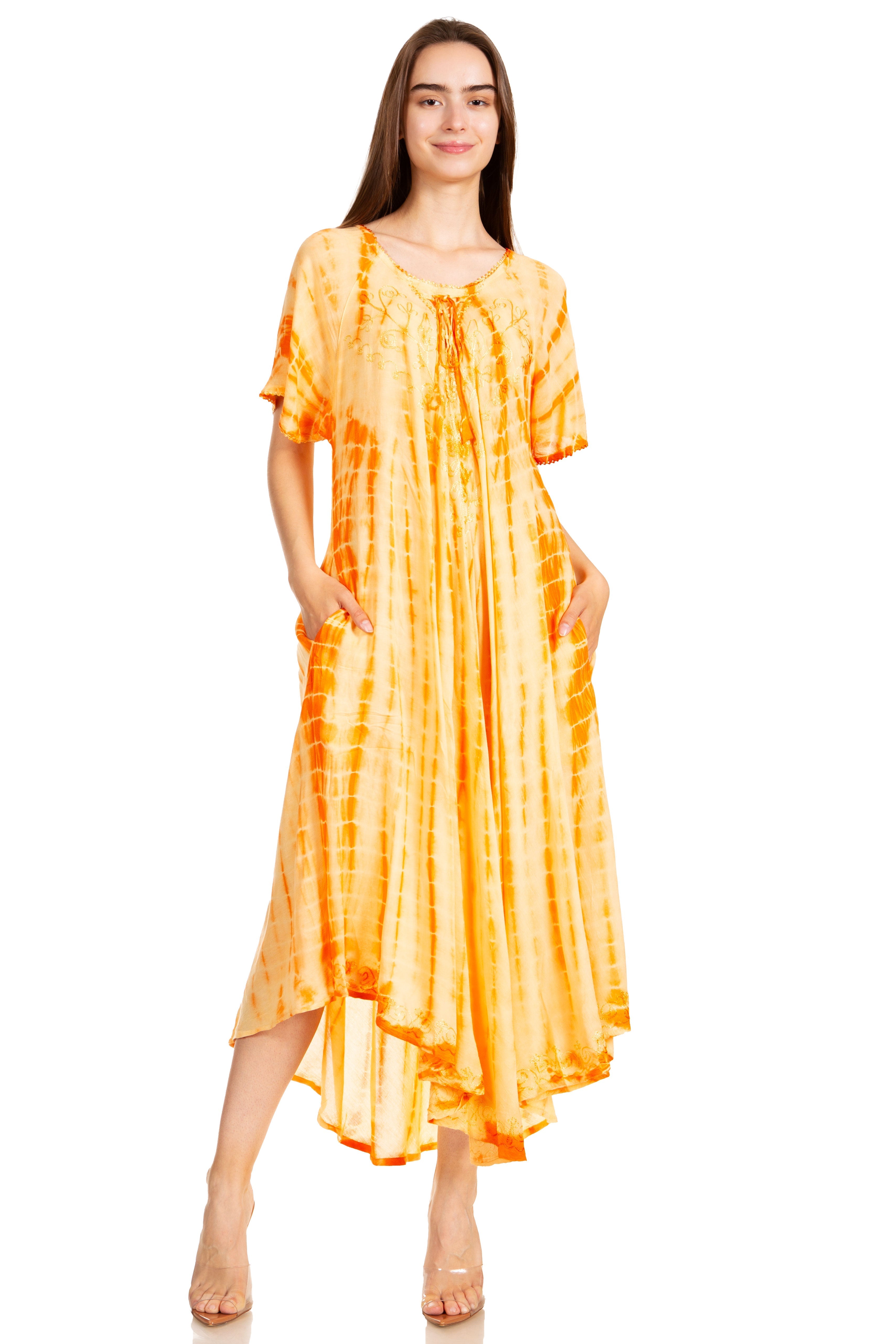 Woman wearing a yellow tie-dye dress on a white background
