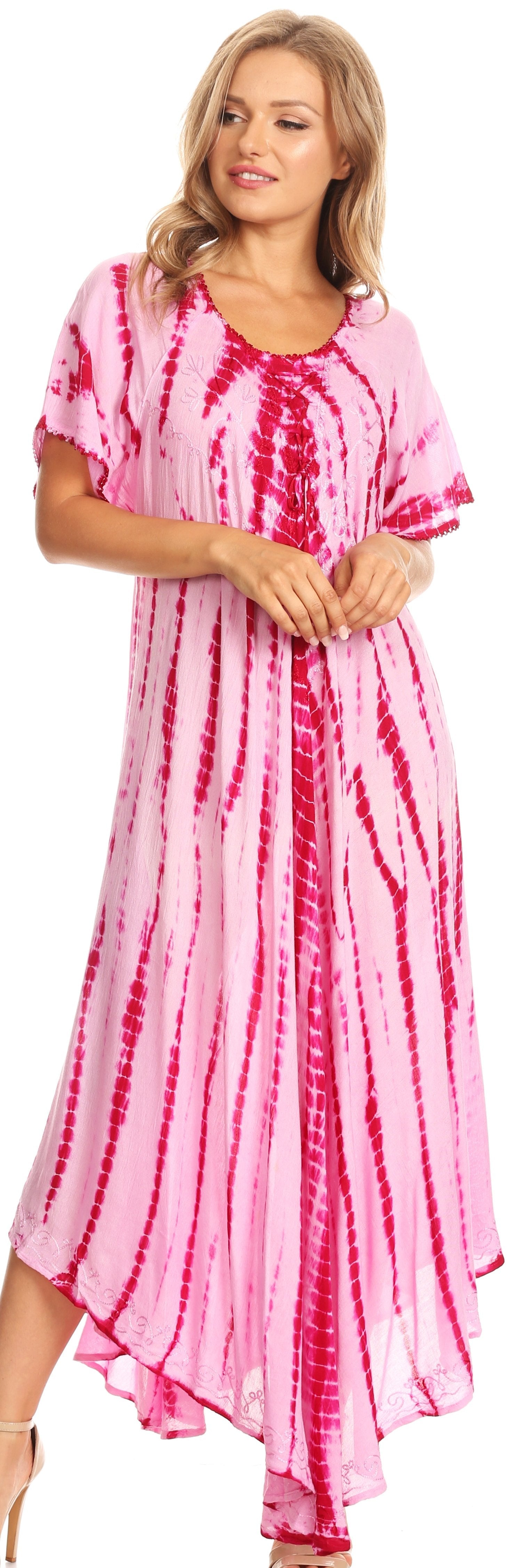 Woman wearing a pink and red tie-dye dress on a white background
