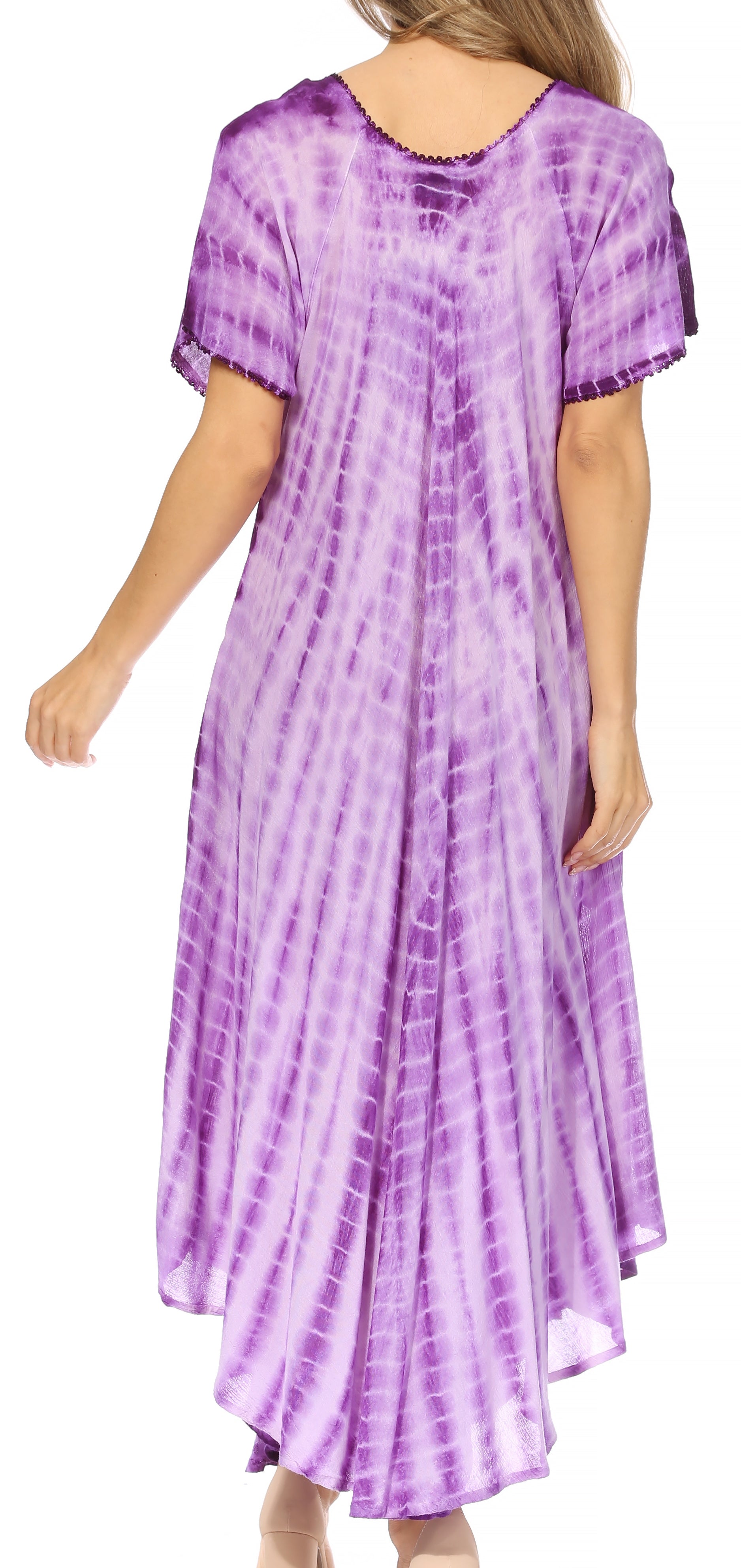 Woman wearing a purple tie-dye dress on a white background